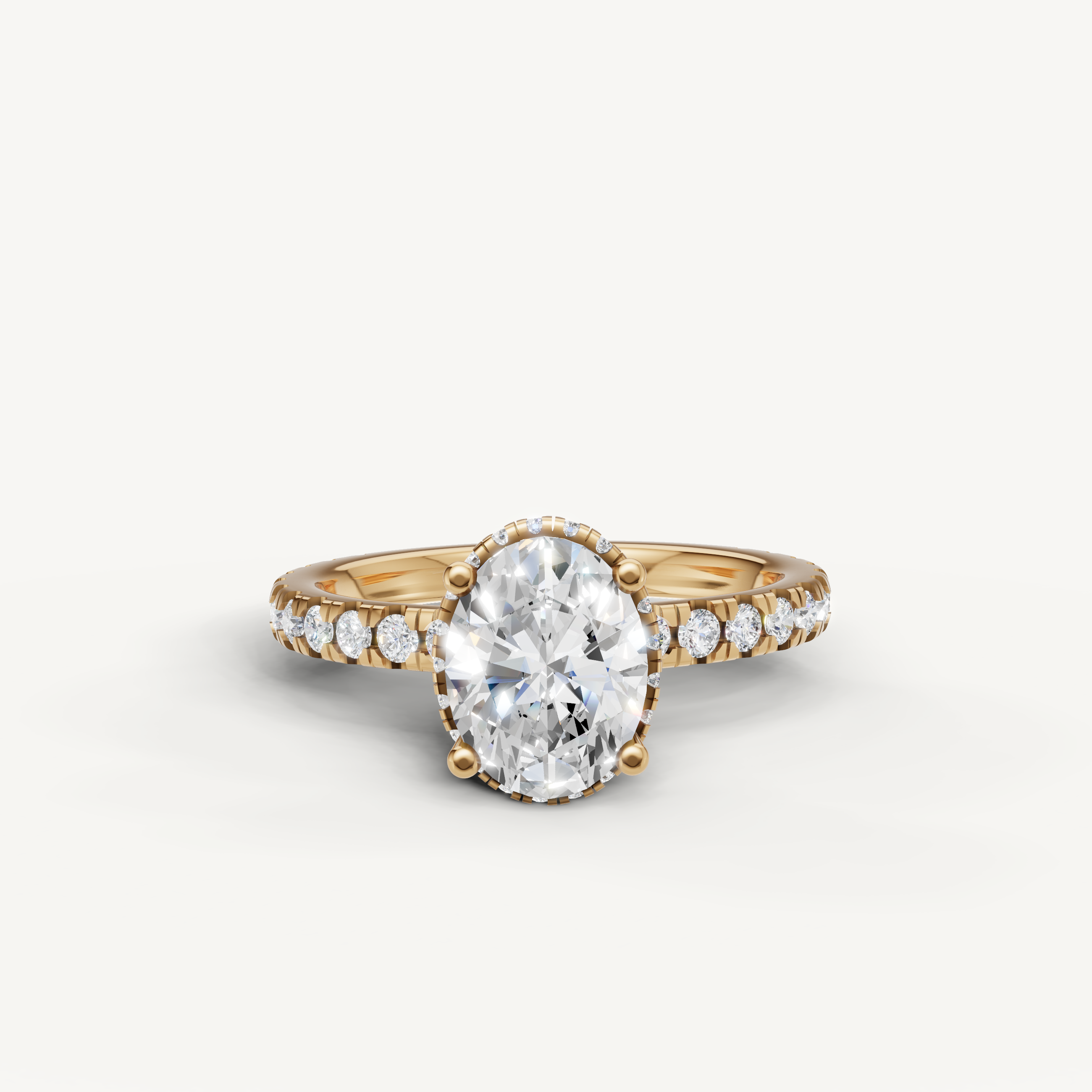 oval cut lab grown diamond engagement ring with hidden halo and pavé band in yellow gold