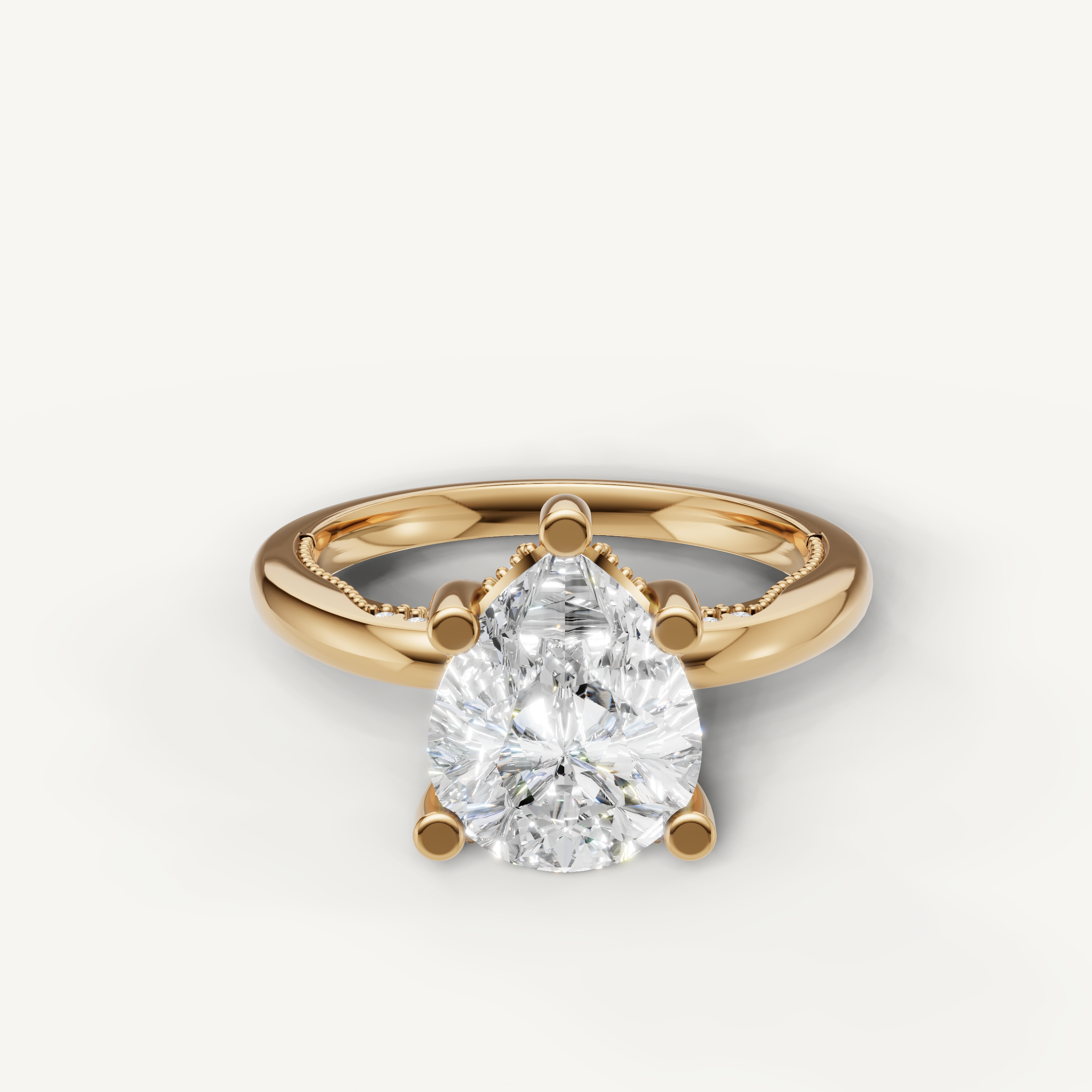 A classic solitaire engagement ring in polished 14k yellow gold, featuring a brilliant, tear-drop shaped pear-cut diamond in a secure prong setting.