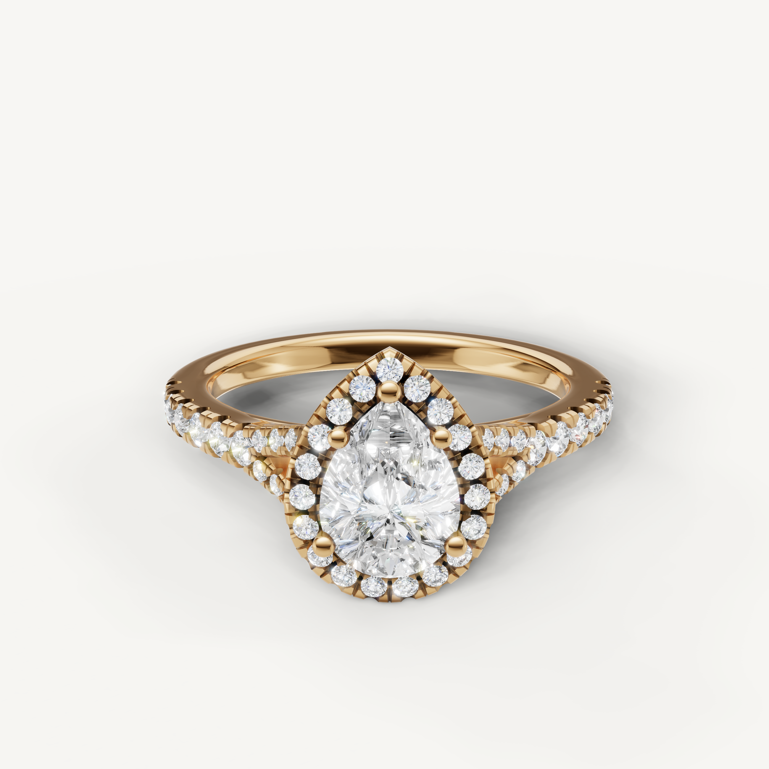 Pear cut halo pavé lab grown diamond engagement ring in 14K yellow gold