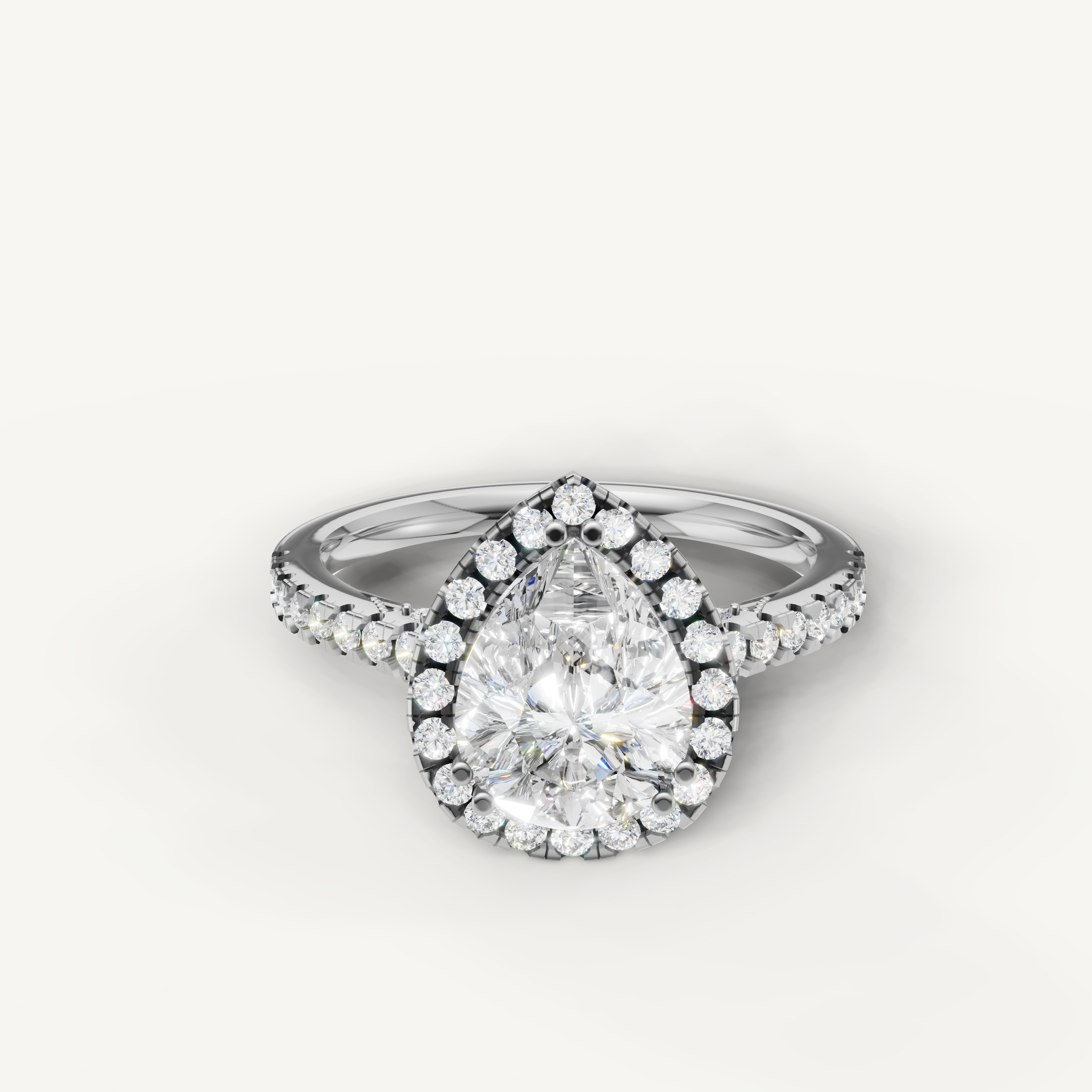 Pear cut lab grown diamond halo engagement ring in 14K white gold with pavé diamond band by Raul Diamonds