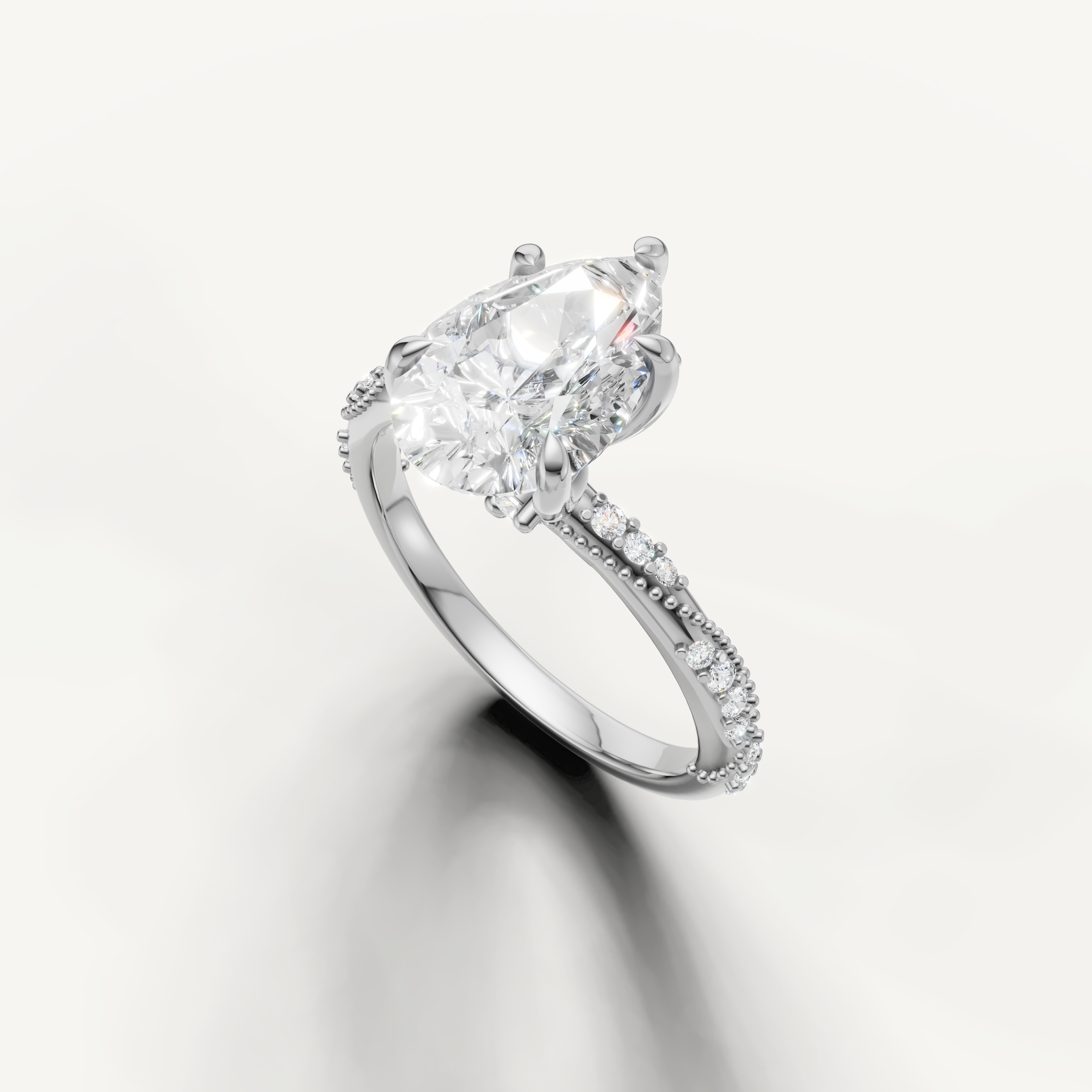 pear shaped lab grown diamond ring with delicate twisted pavé setting white gold