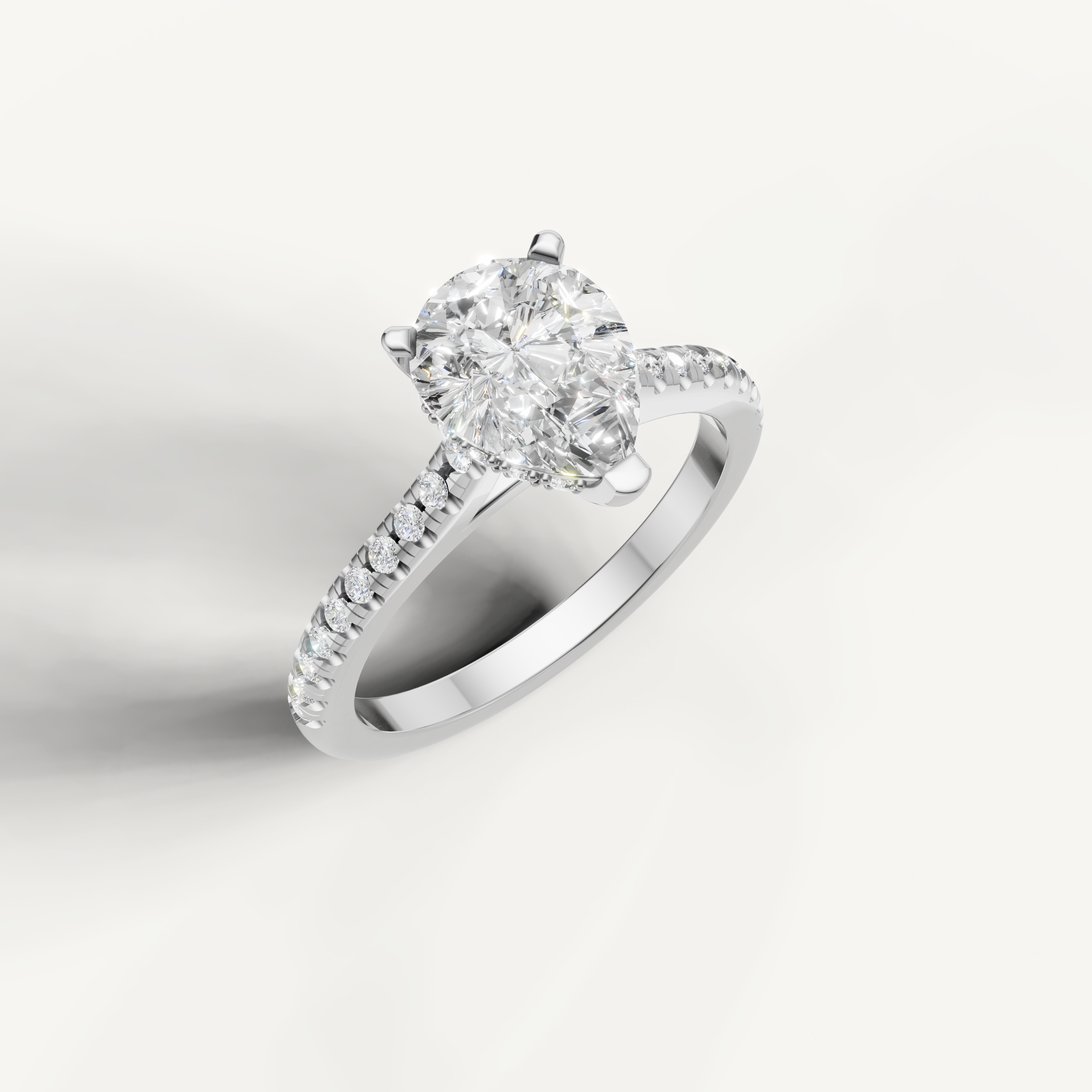 Sophisticated pear shaped lab grown diamond ring in white gold with sparkling pavé accents
