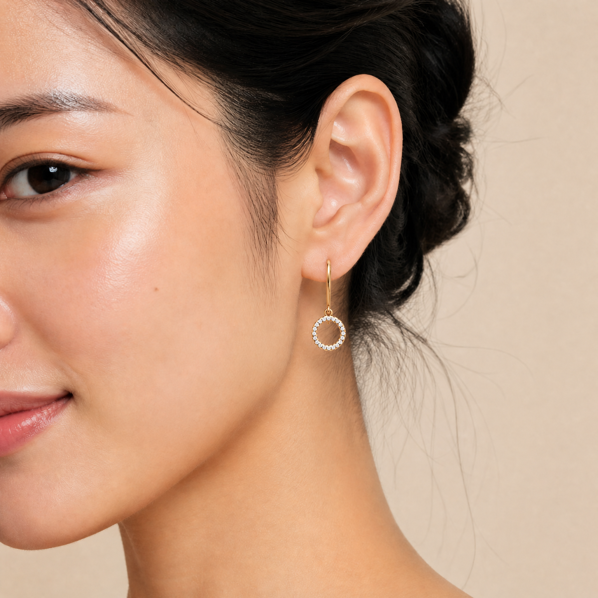 Model wearing Raul Diamonds rose gold open circle diamond drop earrings with elegant luxury styling