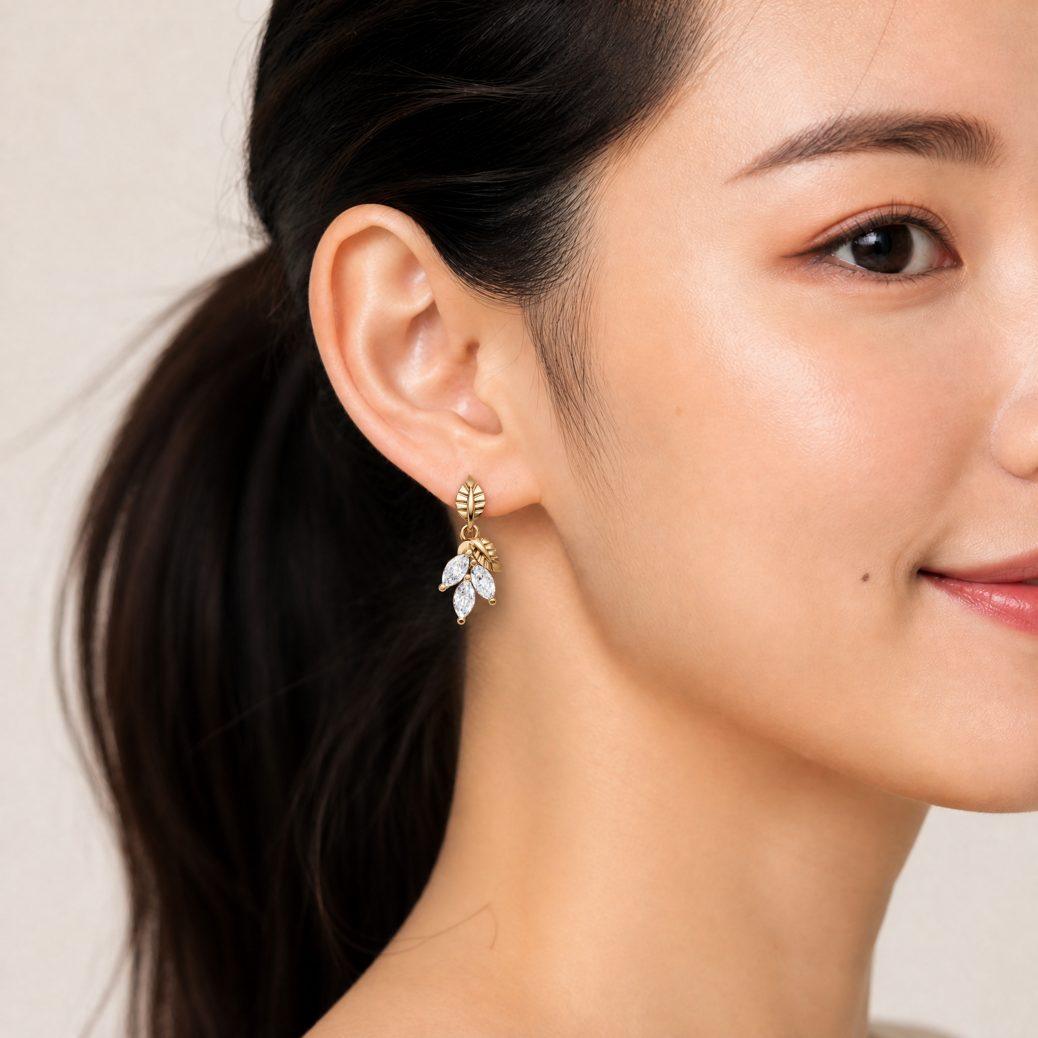 Model wearing Raul Diamonds rose gold marquise diamond leaf drop earrings with luxury styling