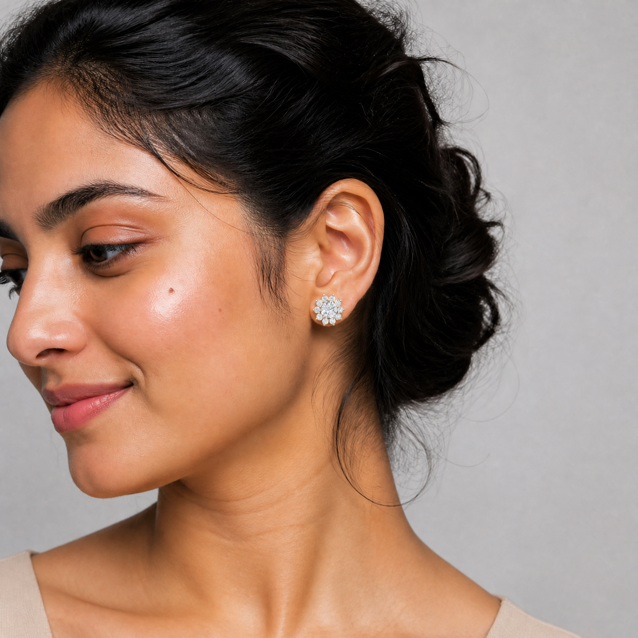 Elegant model wearing Raul Diamonds floral halo diamond stud earrings with luxury sparkle