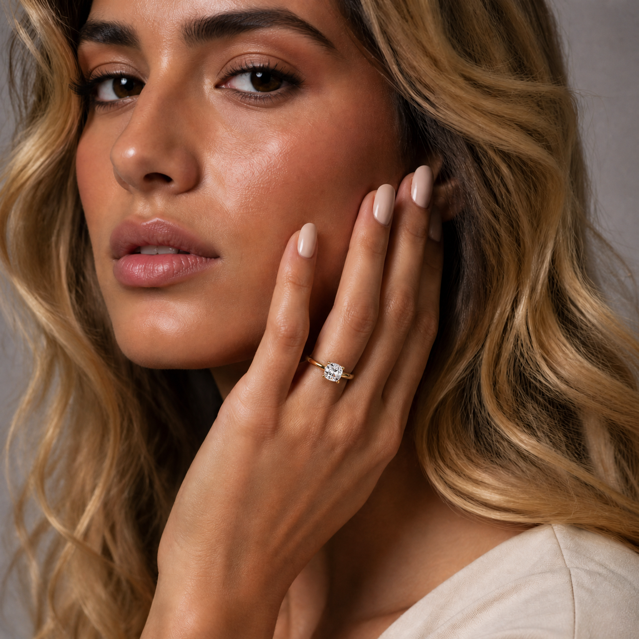 Model wearing Raul Diamonds round solitaire diamond engagement ring in yellow gold