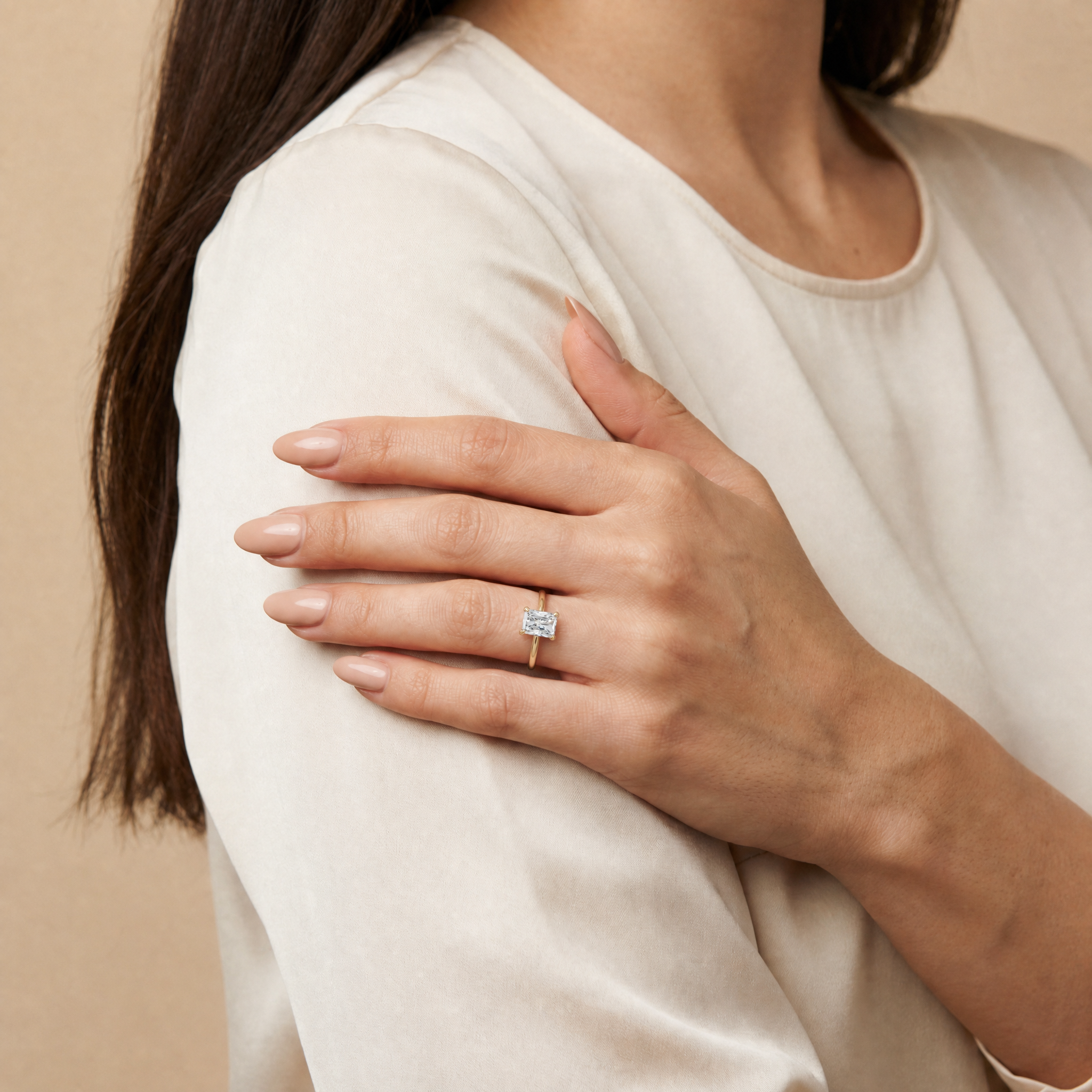 Model Sophia Grace wearing Raul Diamonds radiant cut yellow gold engagement ring with elegant bridal styling
