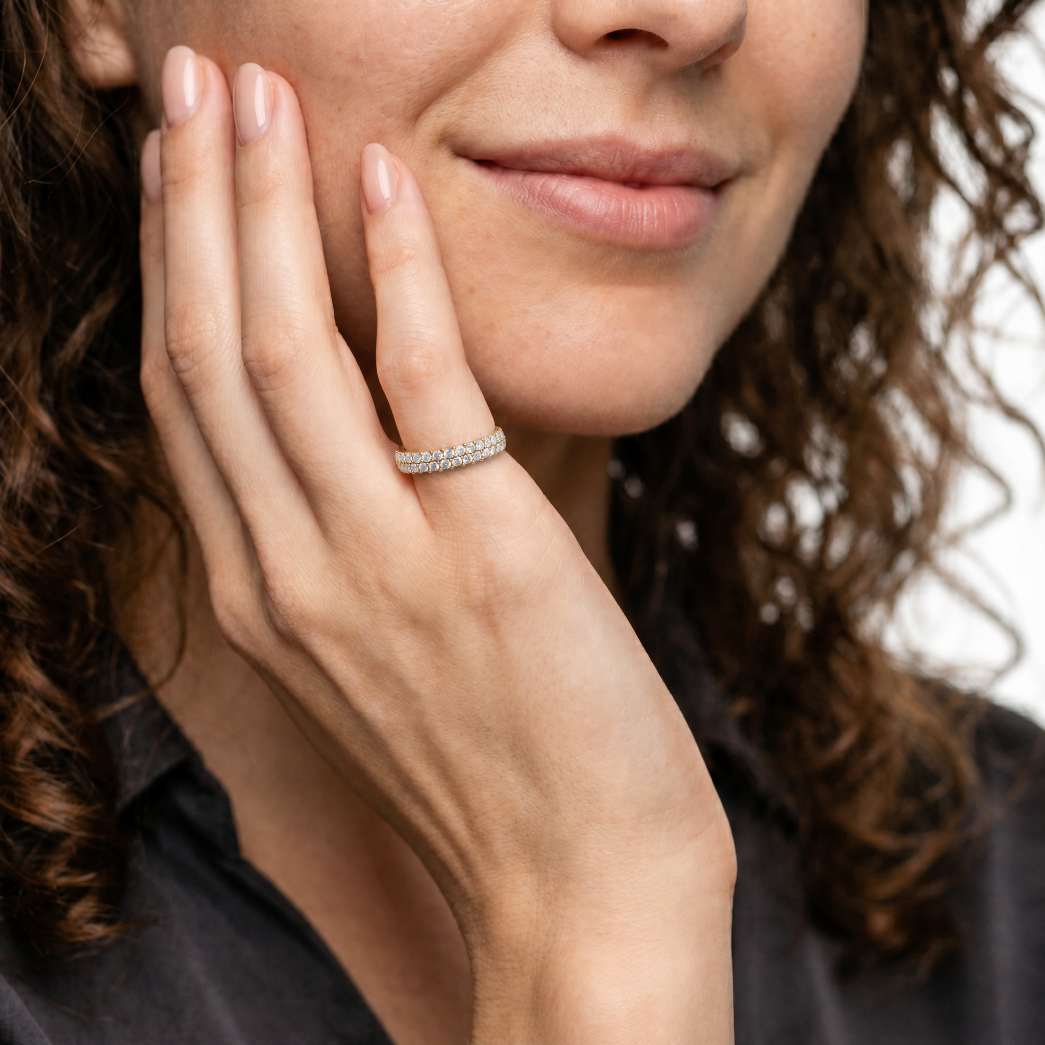 Model Emma Laurent wearing Raul Diamonds yellow gold pavé wedding band with double row round diamonds