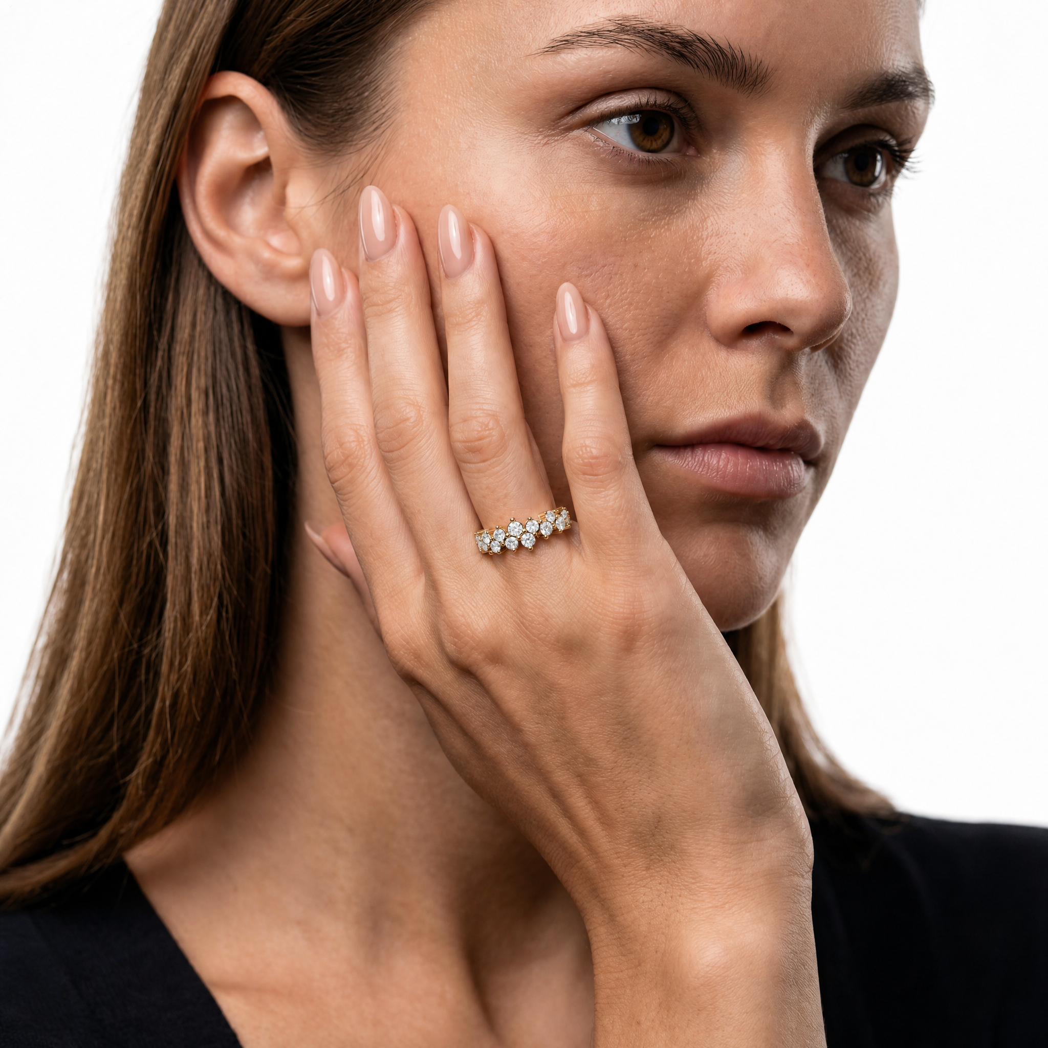 Model Olivia Hart wearing Raul Diamonds yellow gold clustered diamond wedding band with round brilliant stones