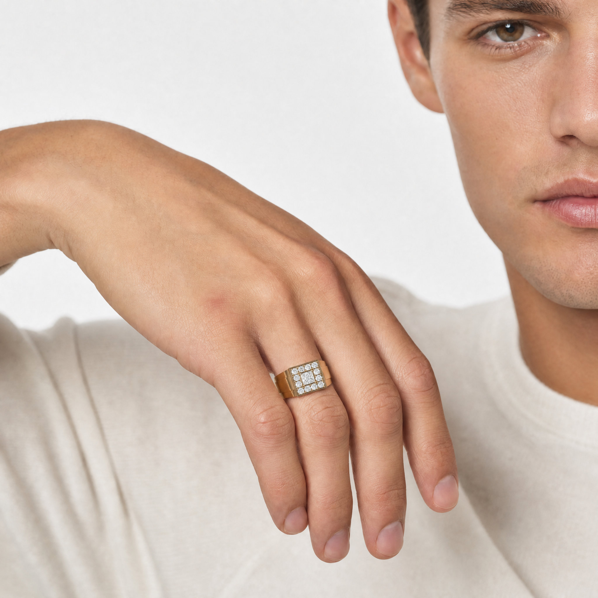 Male model wearing Raul Diamonds yellow gold princess cut diamond wedding band with square halo setting
