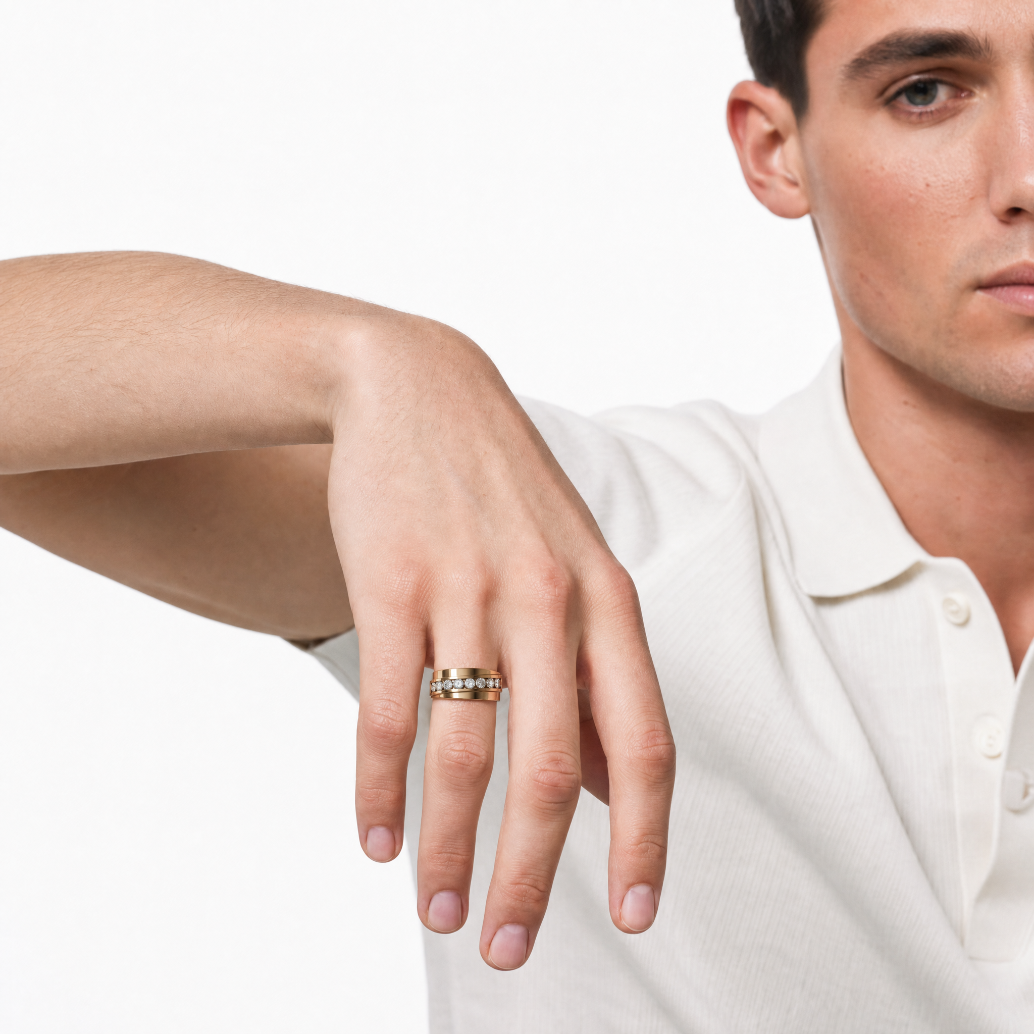 Male model wearing Raul Diamonds yellow gold diamond wedding band with channel set round diamonds and modern luxury styling