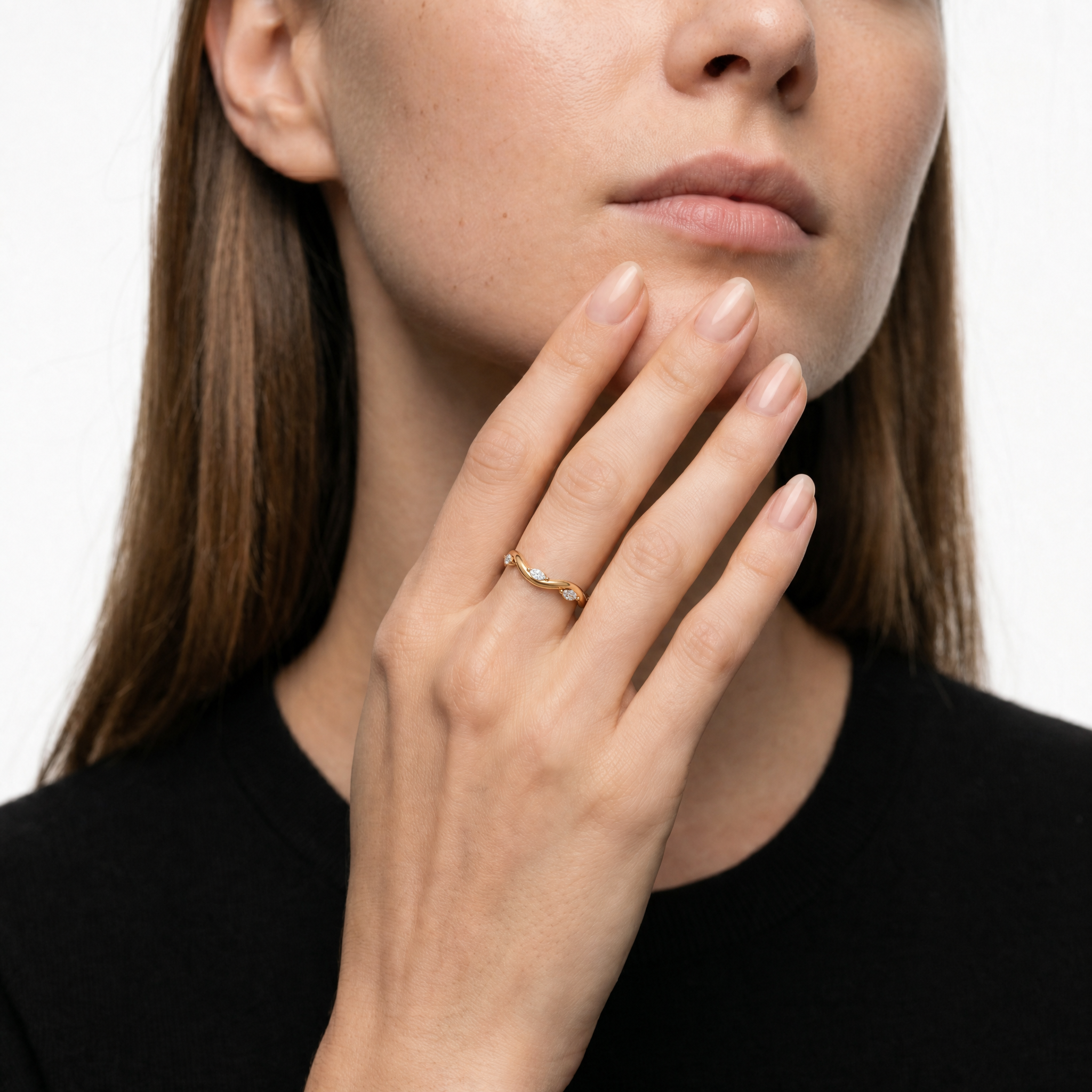 Model wearing Raul Diamonds twisted marquise diamond wedding band in luxurious yellow gold finish