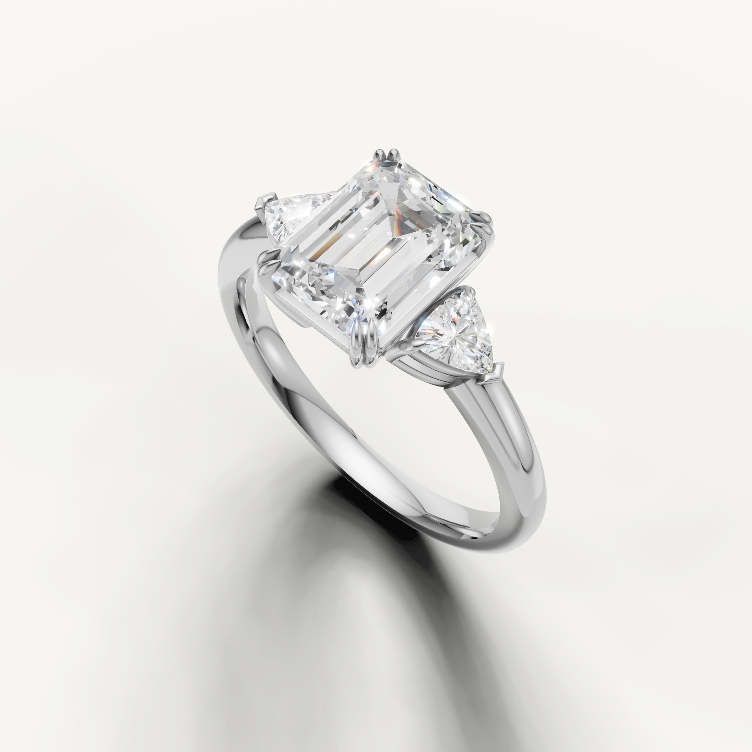 timeless emerald cut lab grown diamond ring with sleek white gold setting and trillion accents