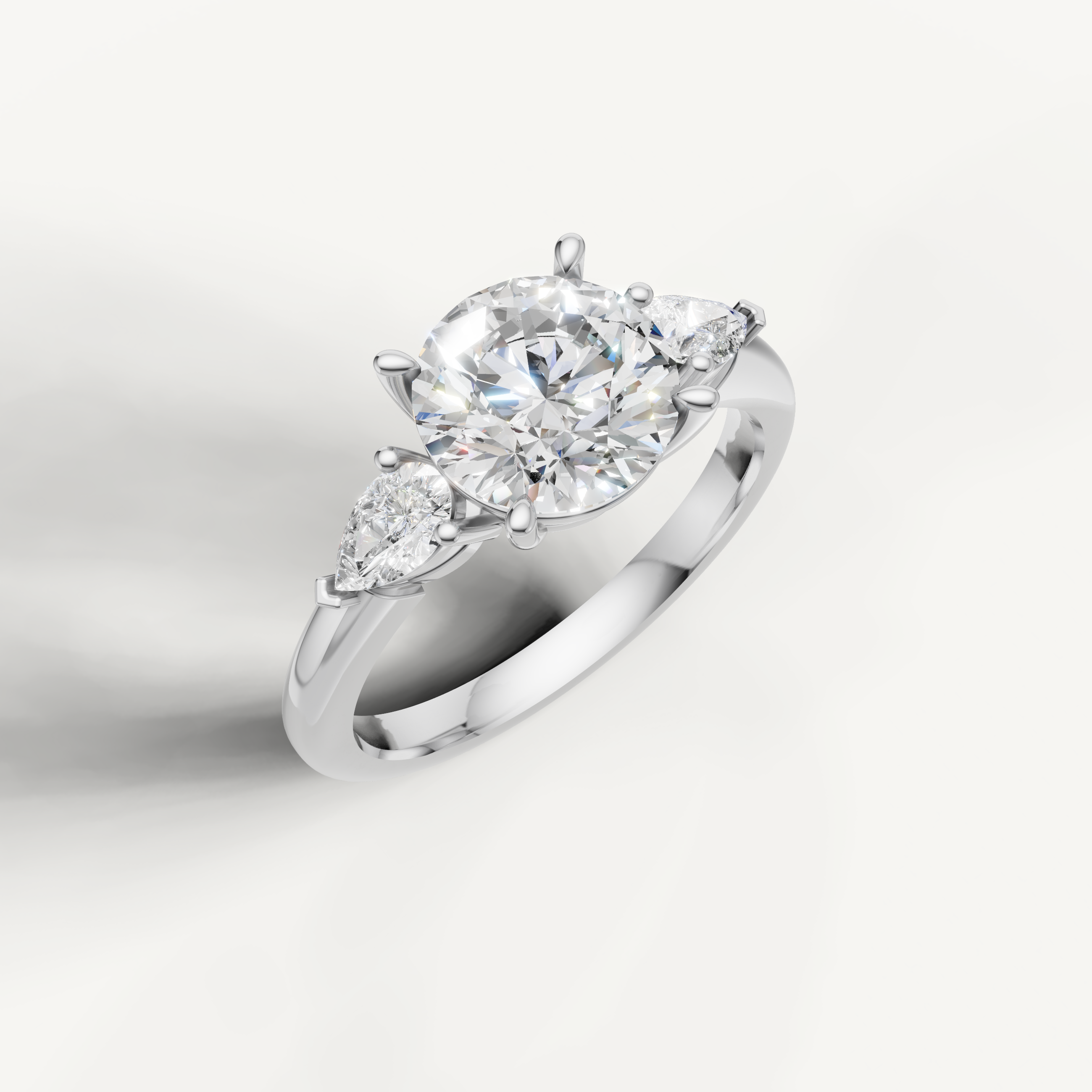 sophisticated round brilliant lab grown diamond trilogy ring with marquise accents