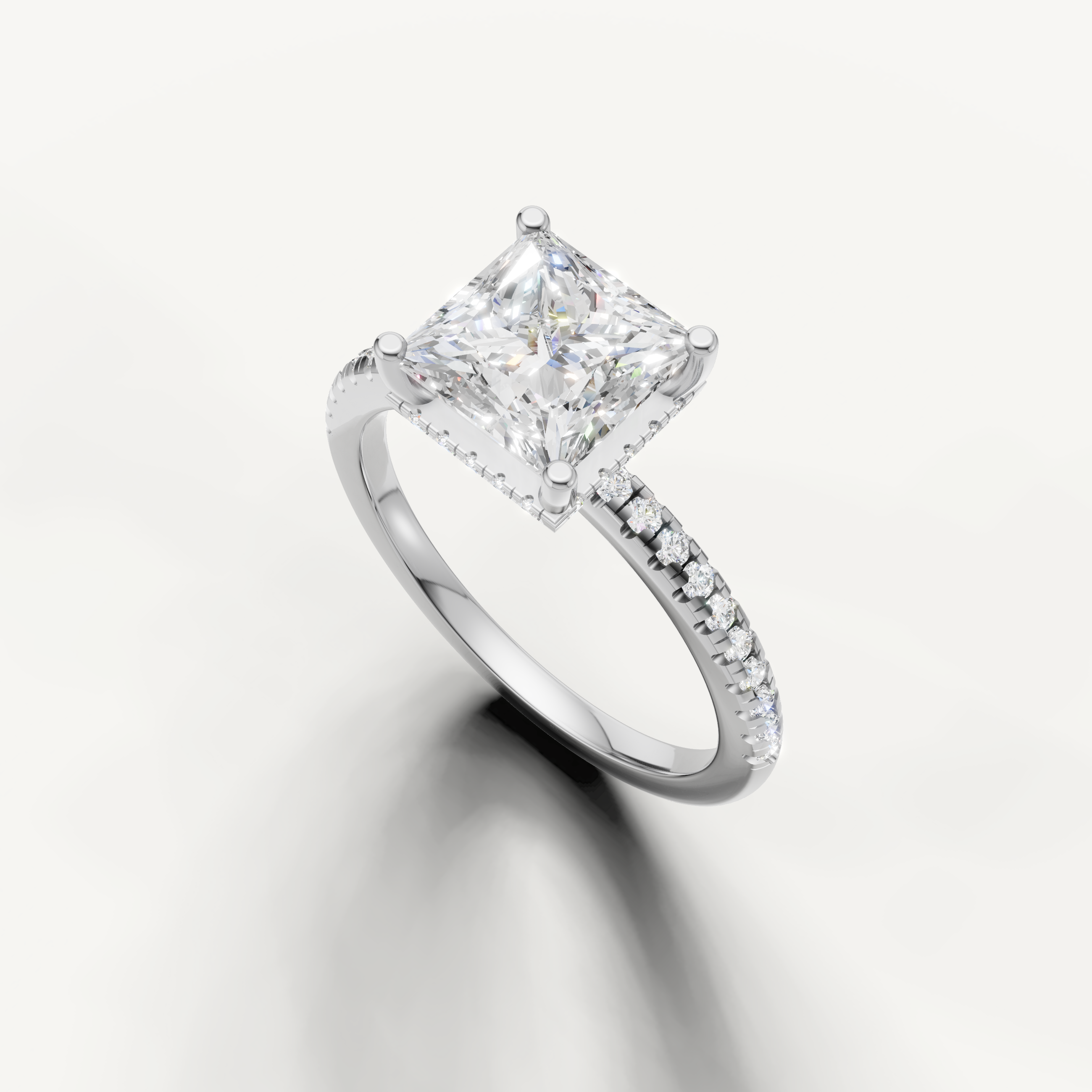 square princess cut engagement ring with sparkling pavé diamonds and slim white gold band