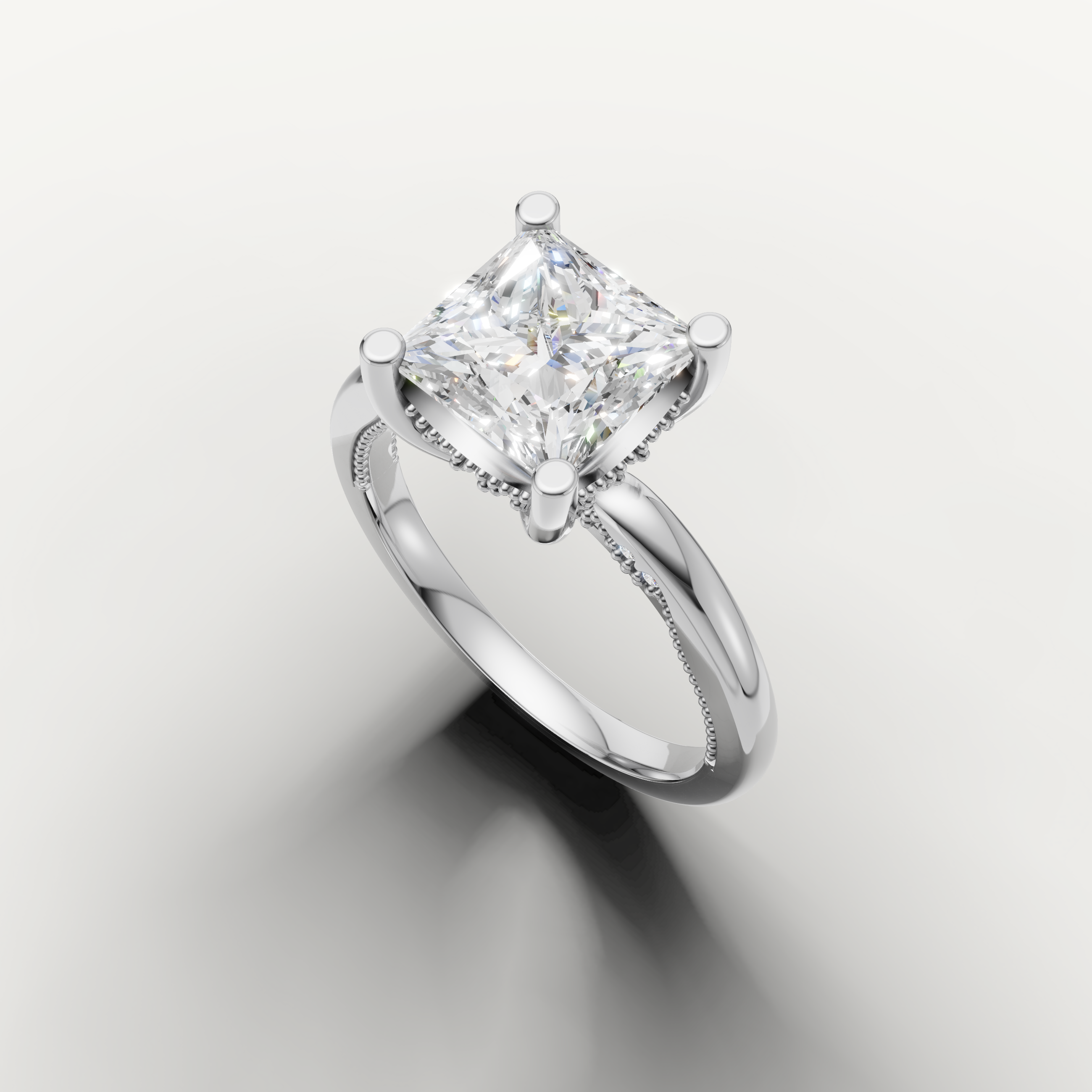 A high-polish white metal solitaire ring showcasing the sophisticated, sharp lines of a large princess-cut diamond.