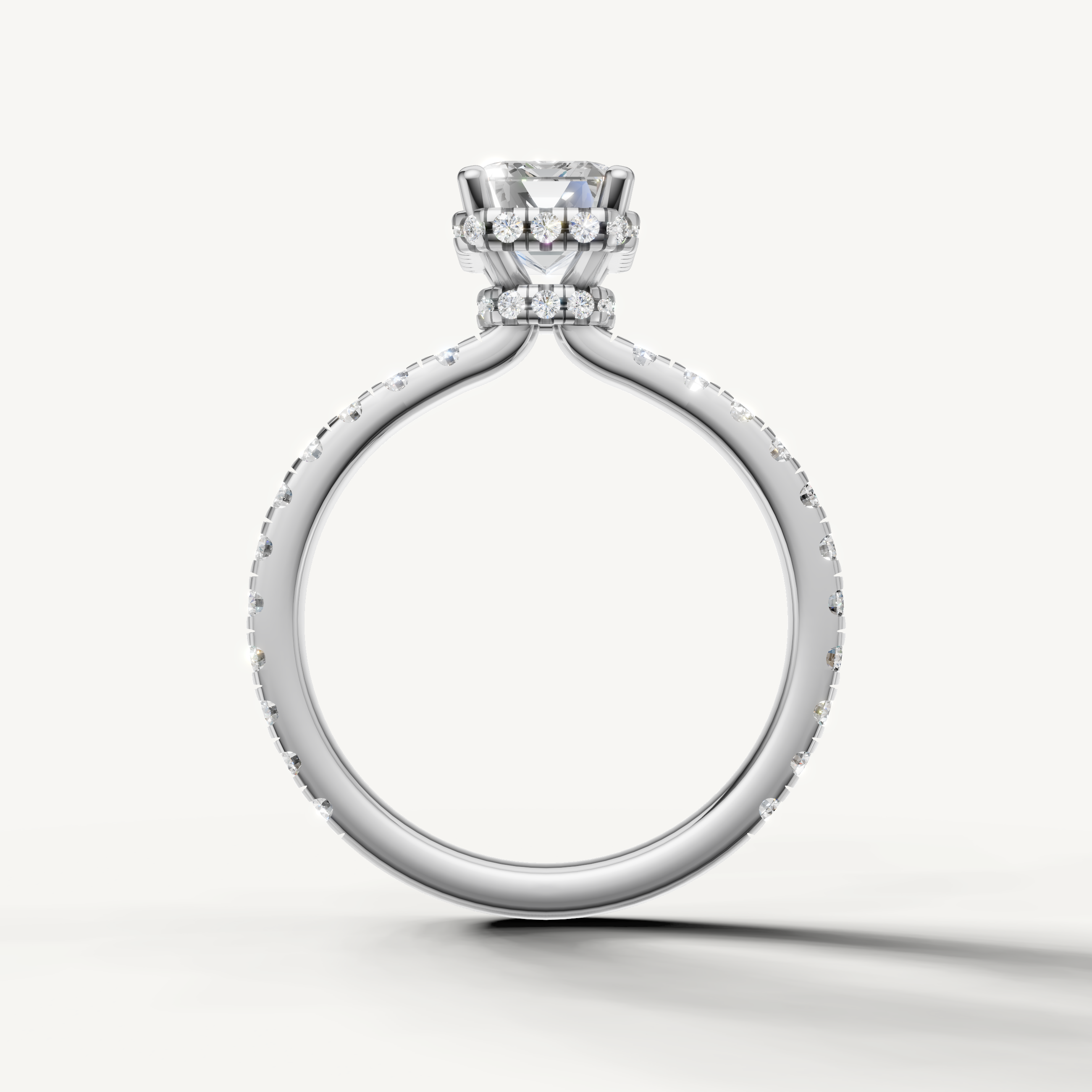 elegant emerald solitaire engagement ring with pavé diamond shank