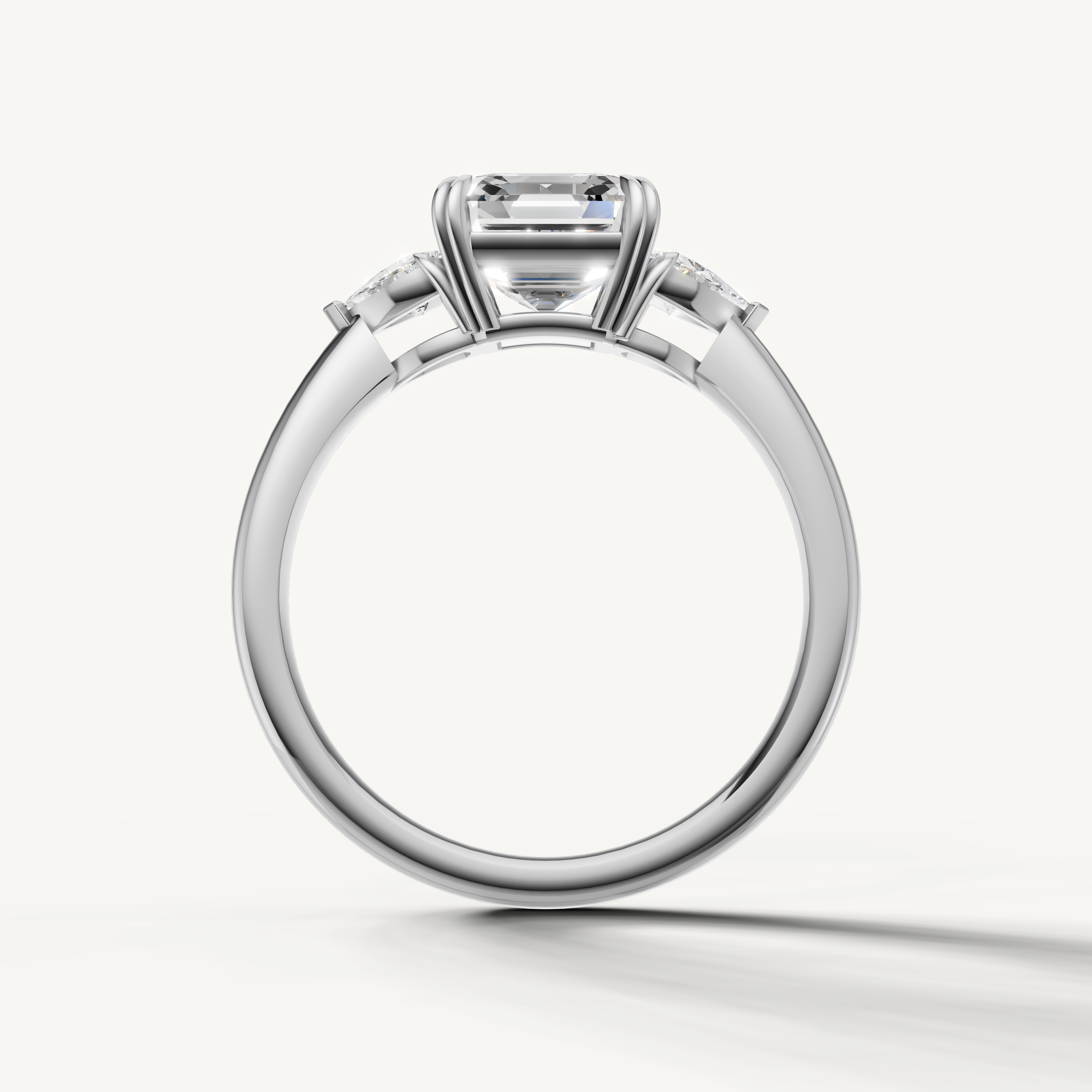 elegant three stone lab grown diamond ring featuring asscher center and trillion accents