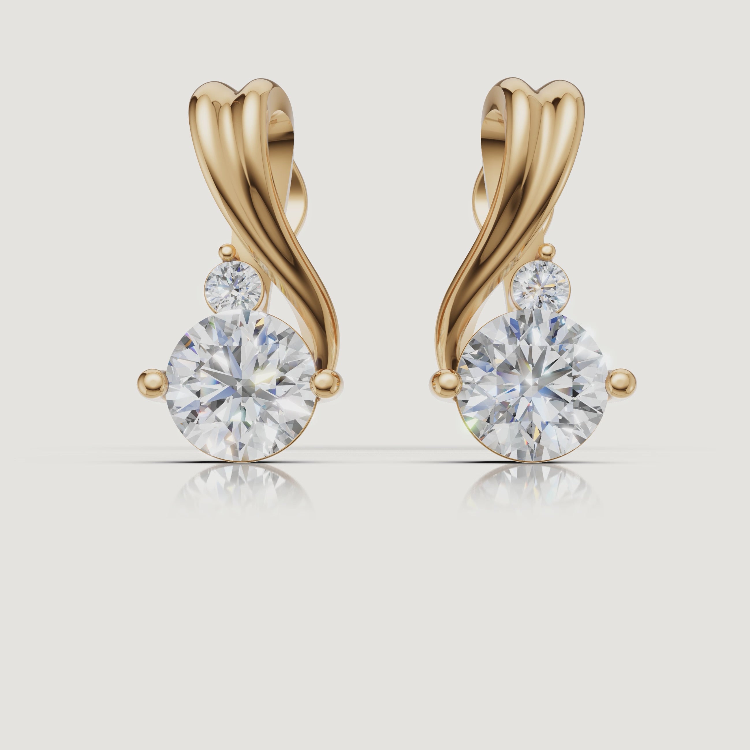 Yellow gold twisted diamond drop earrings cinematic jewelry video by Raul Diamonds