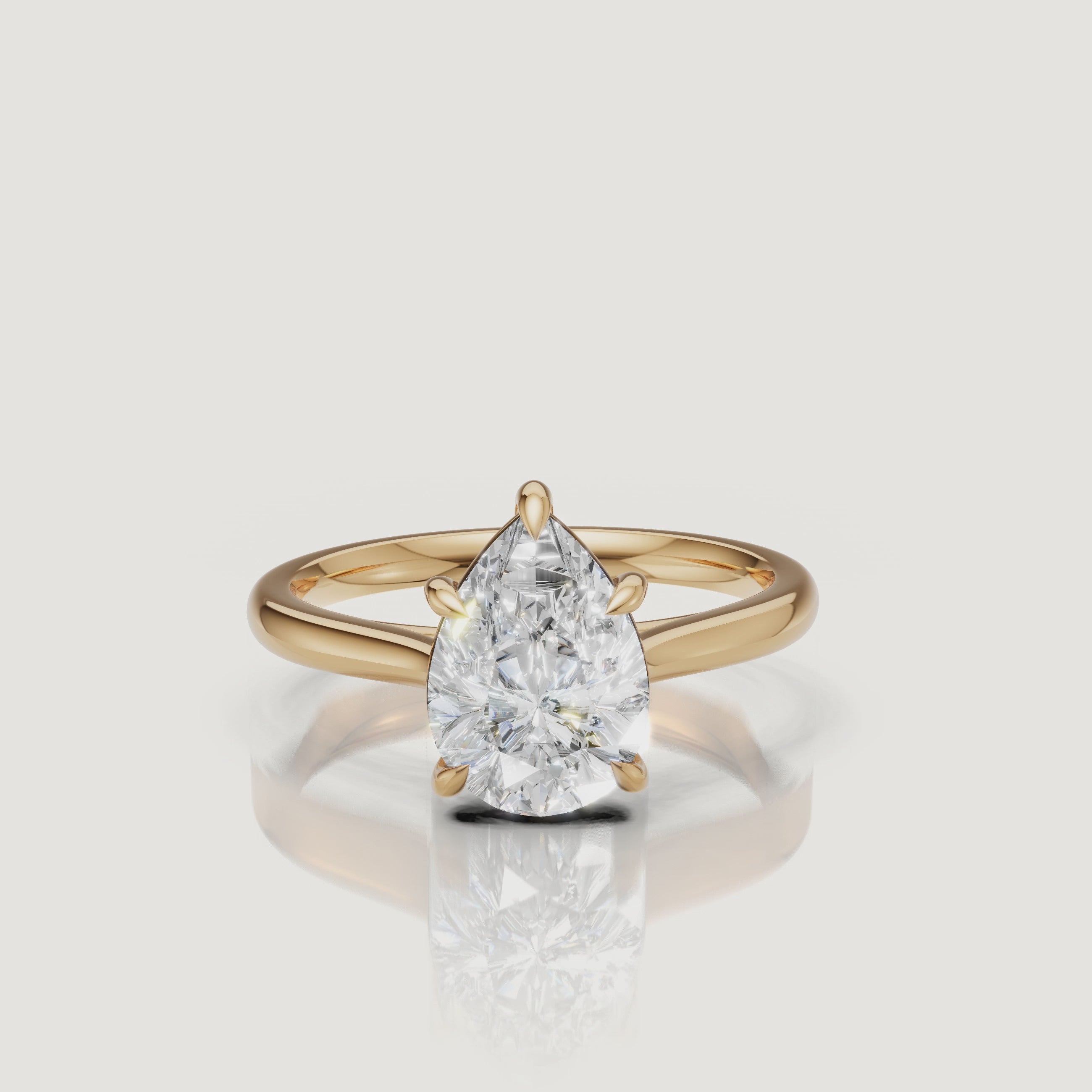 Rotating video of Raul Diamonds pear cut yellow gold solitaire engagement ring with polished band
