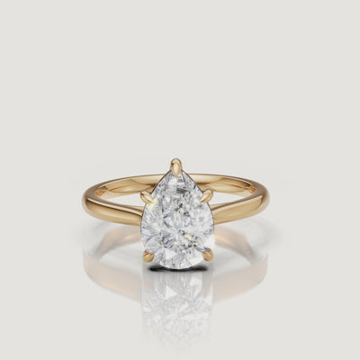 Rotating video of Raul Diamonds pear cut yellow gold solitaire engagement ring with polished band
