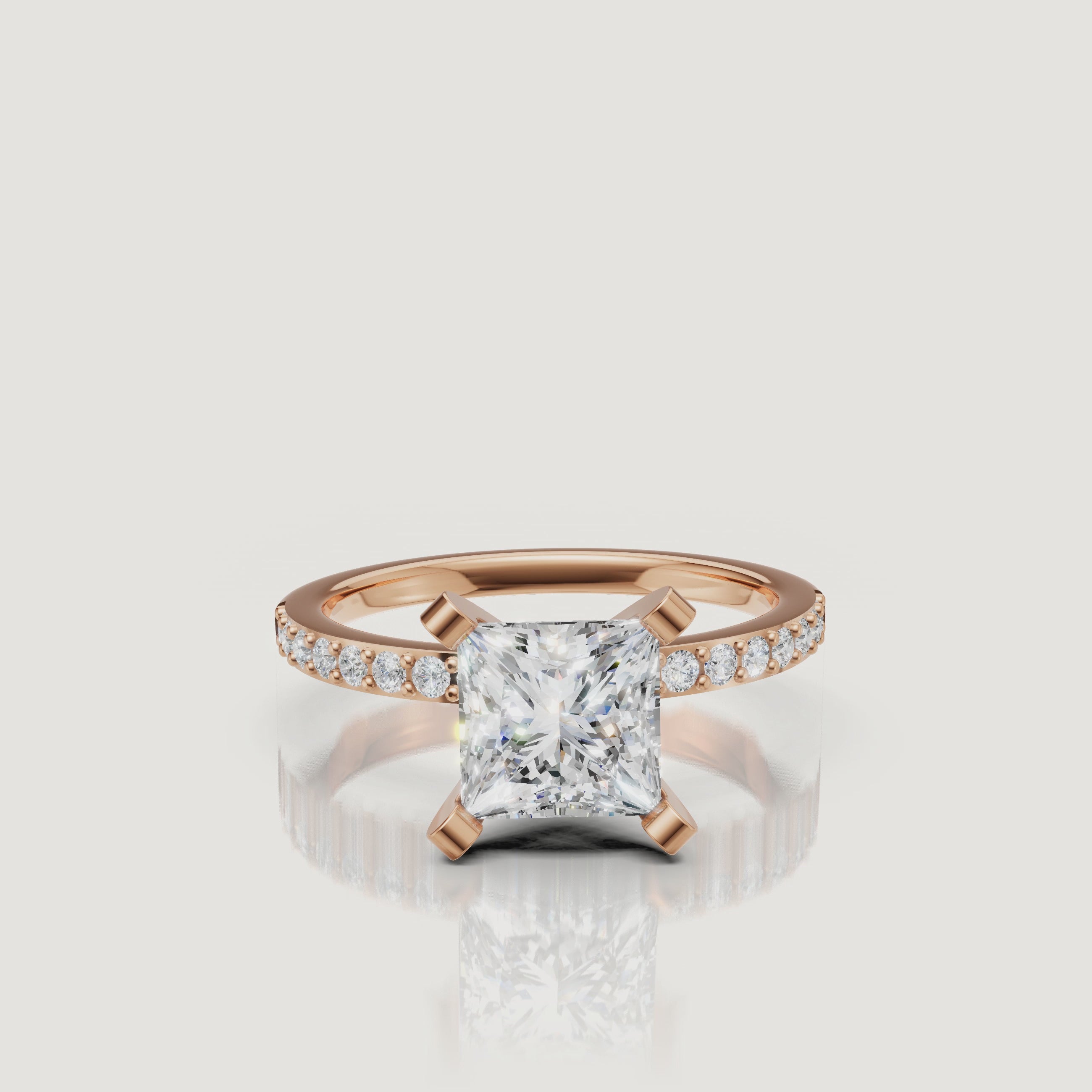 Cinematic showcase of the Sovereign Princess rose gold engagement ring, highlighting the warm blush tones of the metal against a high-clarity princess cut diamond.