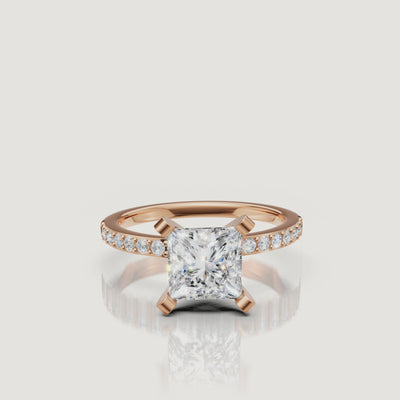 Cinematic showcase of the Sovereign Princess rose gold engagement ring, highlighting the warm blush tones of the metal against a high-clarity princess cut diamond.