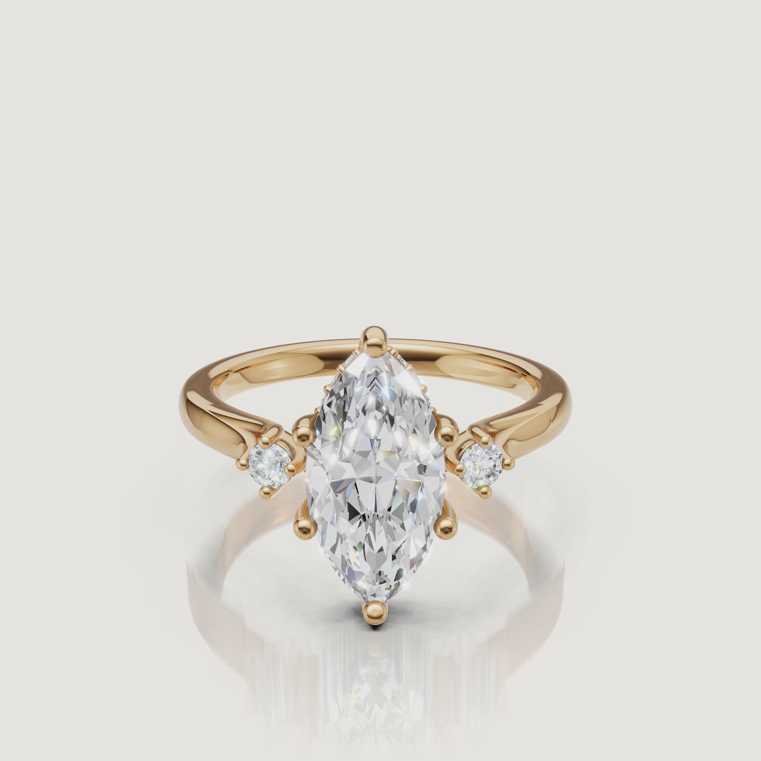 14K yellow gold marquise cut lab grown diamond engagement ring with round side stones by Raul Diamonds