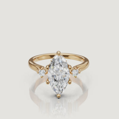 14K yellow gold marquise cut lab grown diamond engagement ring with round side stones by Raul Diamonds
