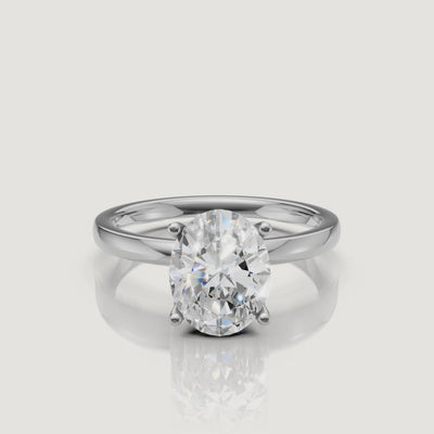 Cinematic video of a white gold oval cut solitaire engagement ring from Raul Diamonds, demonstrating the 'bow-tie' free brilliance and sleek modern band design