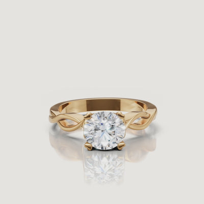 360 video of Raul Diamonds emerald cut engagement ring in yellow gold with twist band design.