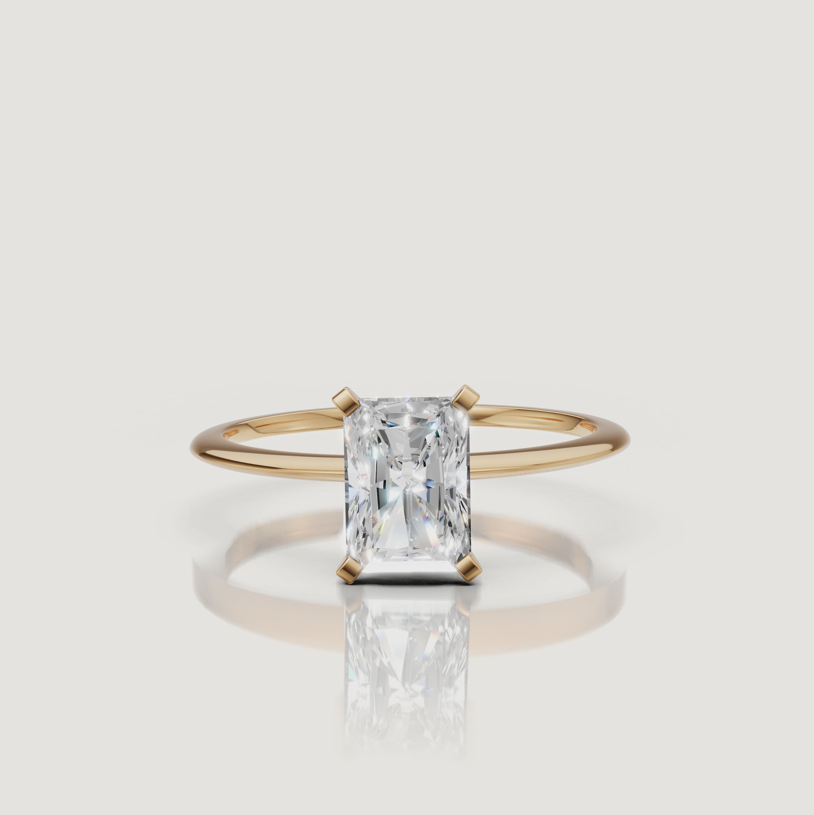Cinematic video of a radiant cut lab grown diamond solitaire engagement ring in yellow gold by Raul Diamonds featuring macro diamond sparkle, elegant hand movement, warm luxury lighting, and premium bridal jewelry styling