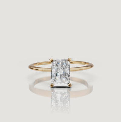 Cinematic video of a radiant cut lab grown diamond solitaire engagement ring in yellow gold by Raul Diamonds featuring macro diamond sparkle, elegant hand movement, warm luxury lighting, and premium bridal jewelry styling