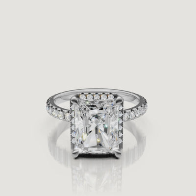 Lifestyle video of the Isabella model wearing a Raul Diamonds white gold Radiant engagement ring, emphasizing the brilliant hidden halo and micro-pavé setting