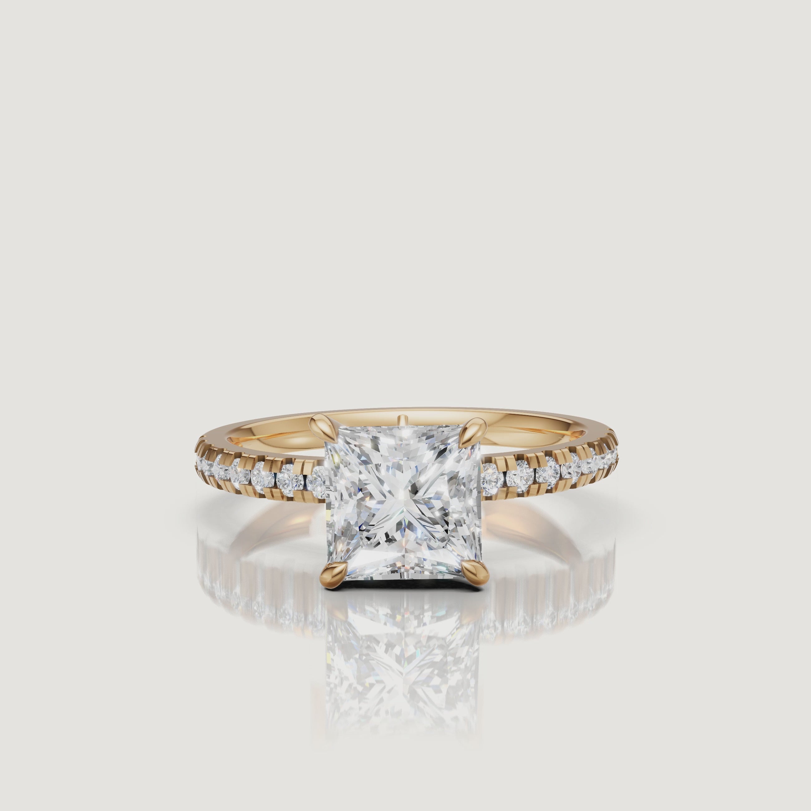 Cinematic 4K video of a yellow gold princess-cut diamond ring by Raul Diamonds, showing a 360-degree view of the pavé-set diamond band and the rich warmth of the 18k gold.