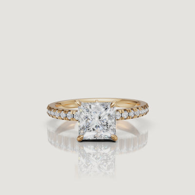 Cinematic 4K video of a yellow gold princess-cut diamond ring by Raul Diamonds, showing a 360-degree view of the pavé-set diamond band and the rich warmth of the 18k gold.
