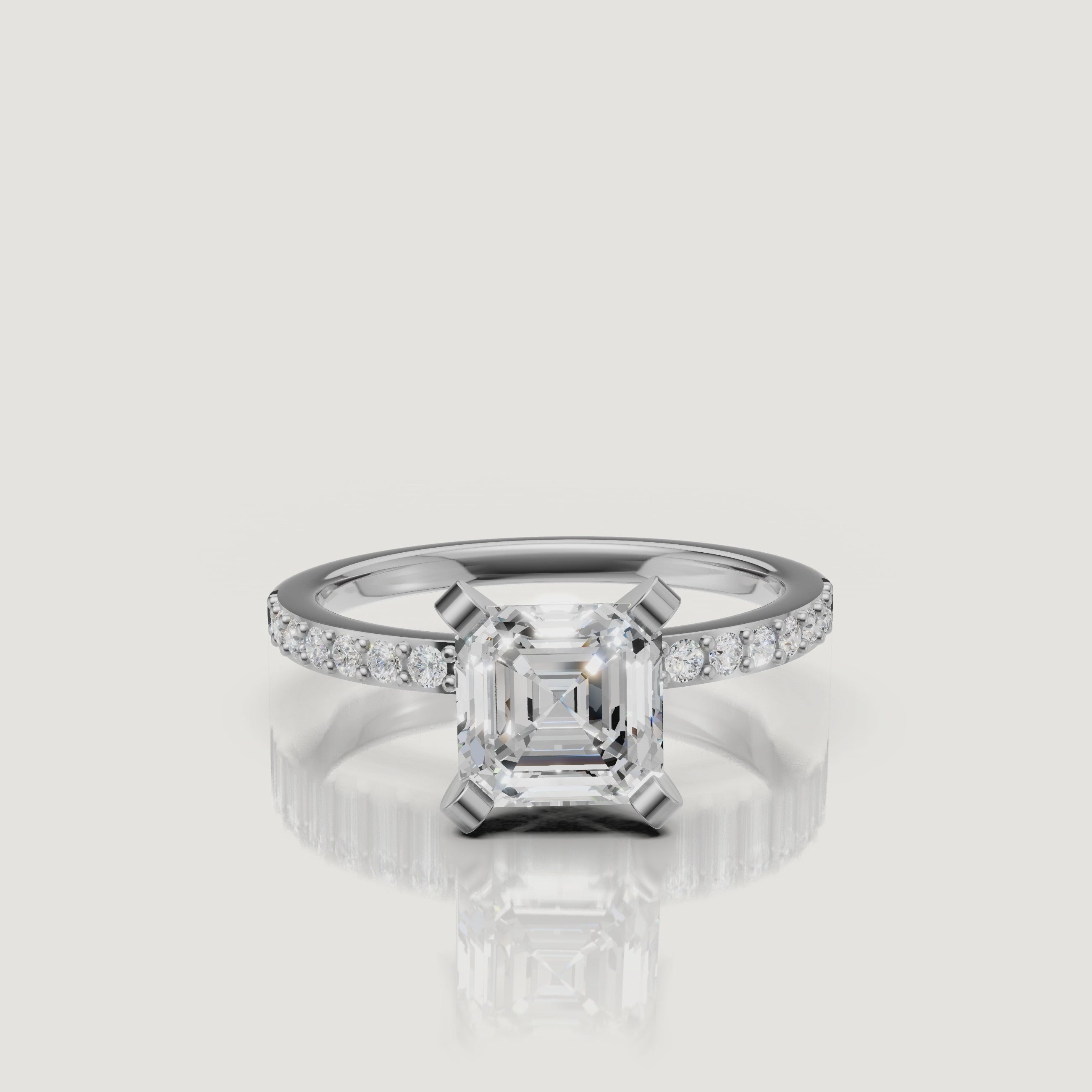 High-definition video showcase of the Raul Diamonds white gold Asscher cut engagement ring, focusing on the precision of the step-cut facets and the continuous pavé sparkle.