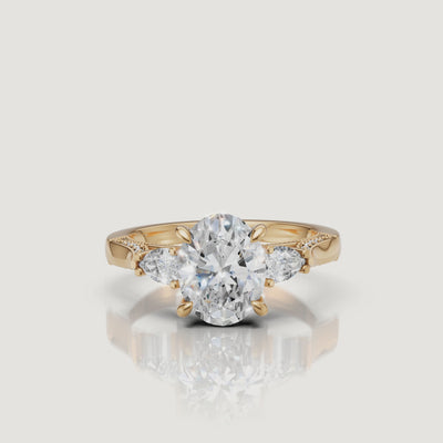 Cinematic View: Raul Diamonds Yellow Gold Oval Cut Ring with Pear Side Stones