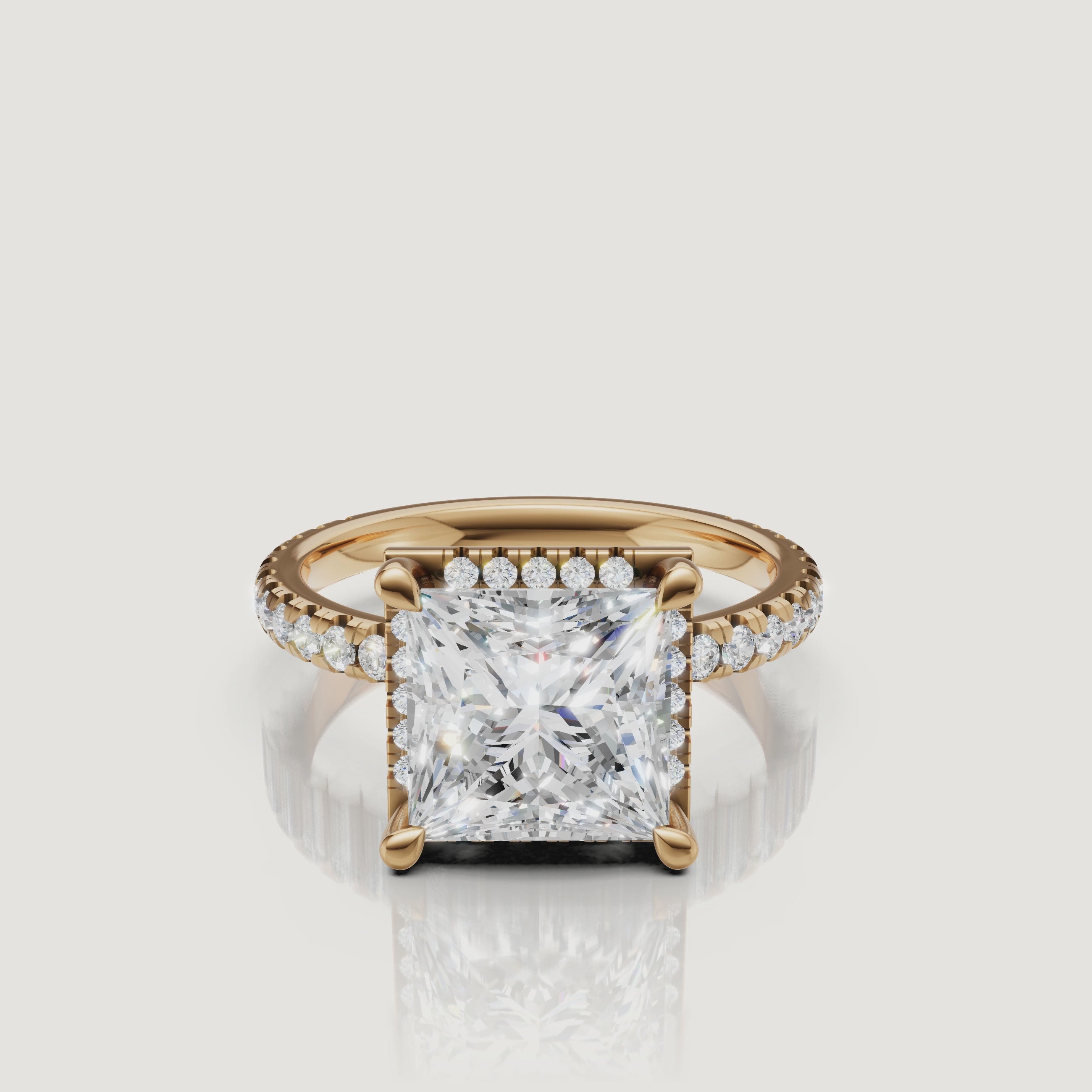 360-degree high-definition video of a Raul Diamonds Princess Cut Hidden Halo ring in 18k yellow gold with a shimmering pavé shank