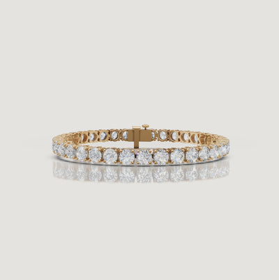 Cinematic video of a 12 carat lab grown diamond tennis bracelet in 14K yellow gold by Raul Diamonds featuring round brilliant diamonds, luxury macro close-ups, radiant sparkle, graceful wrist movement, warm studio lighting, and premium fine jewelry craftsmanship.