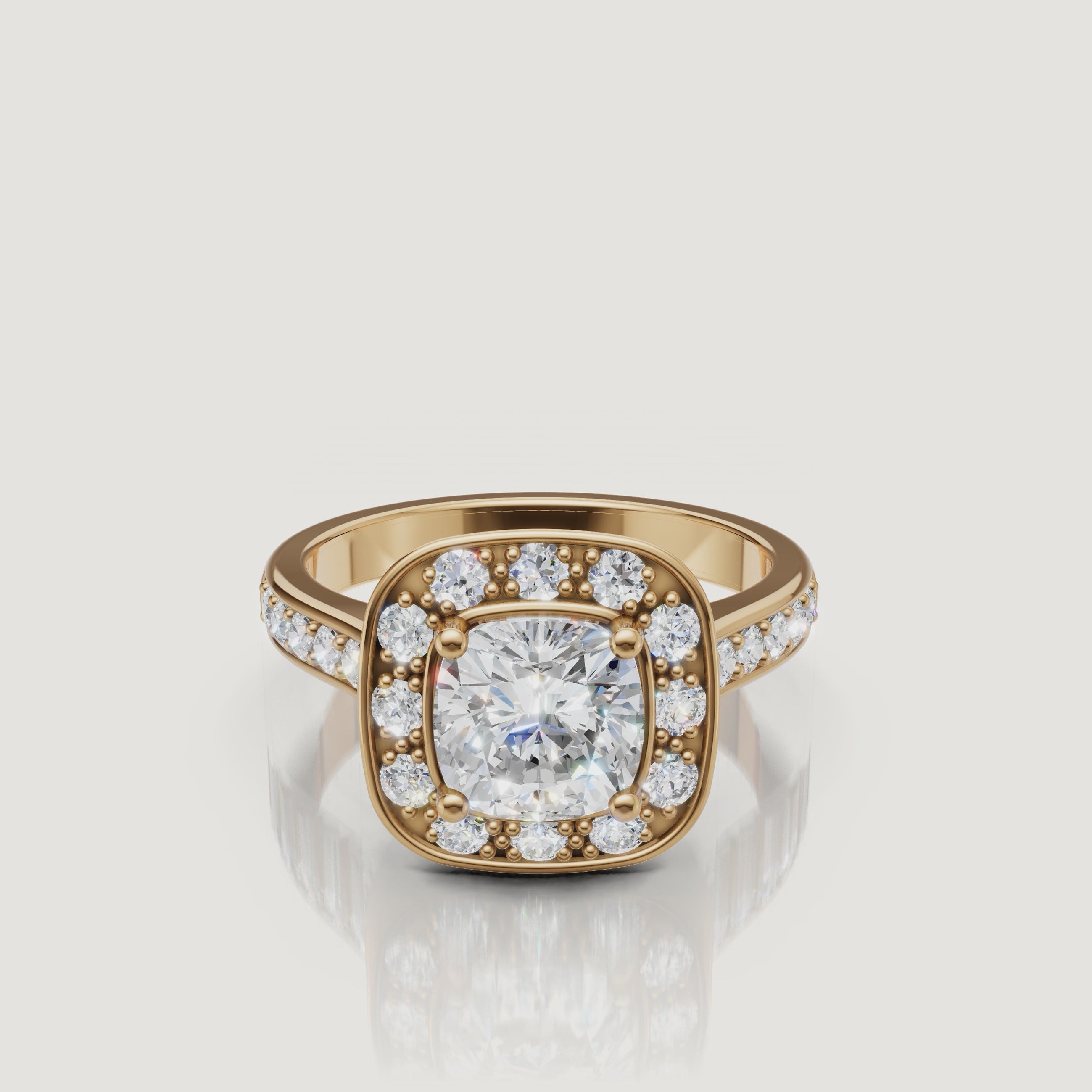 Raul Diamonds yellow gold cushion cut halo engagement ring with pave diamond band.