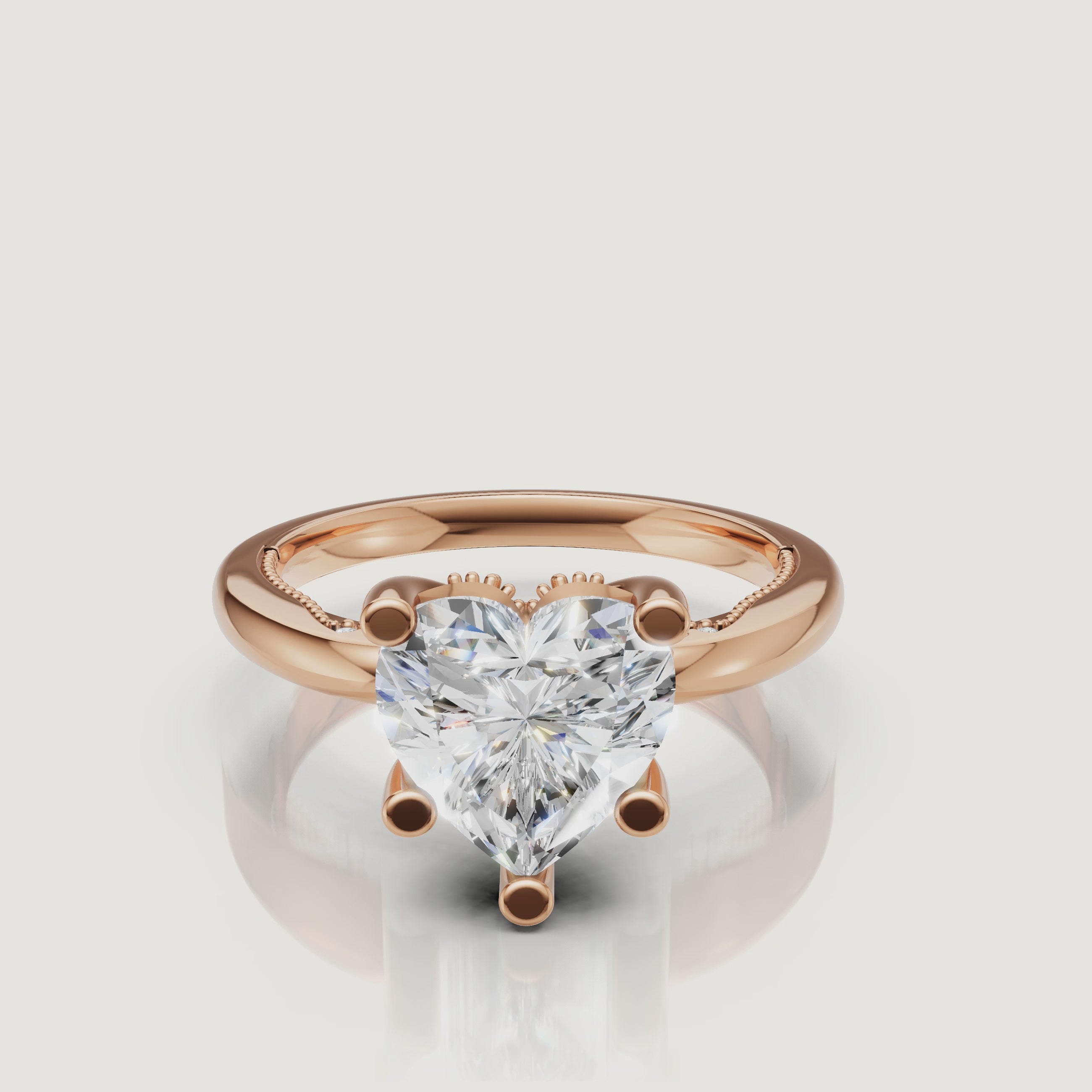 Close-up 4K video of a rose gold heart-shaped diamond ring by Raul Diamonds, highlighting the romantic blush metal and fire of the center stone