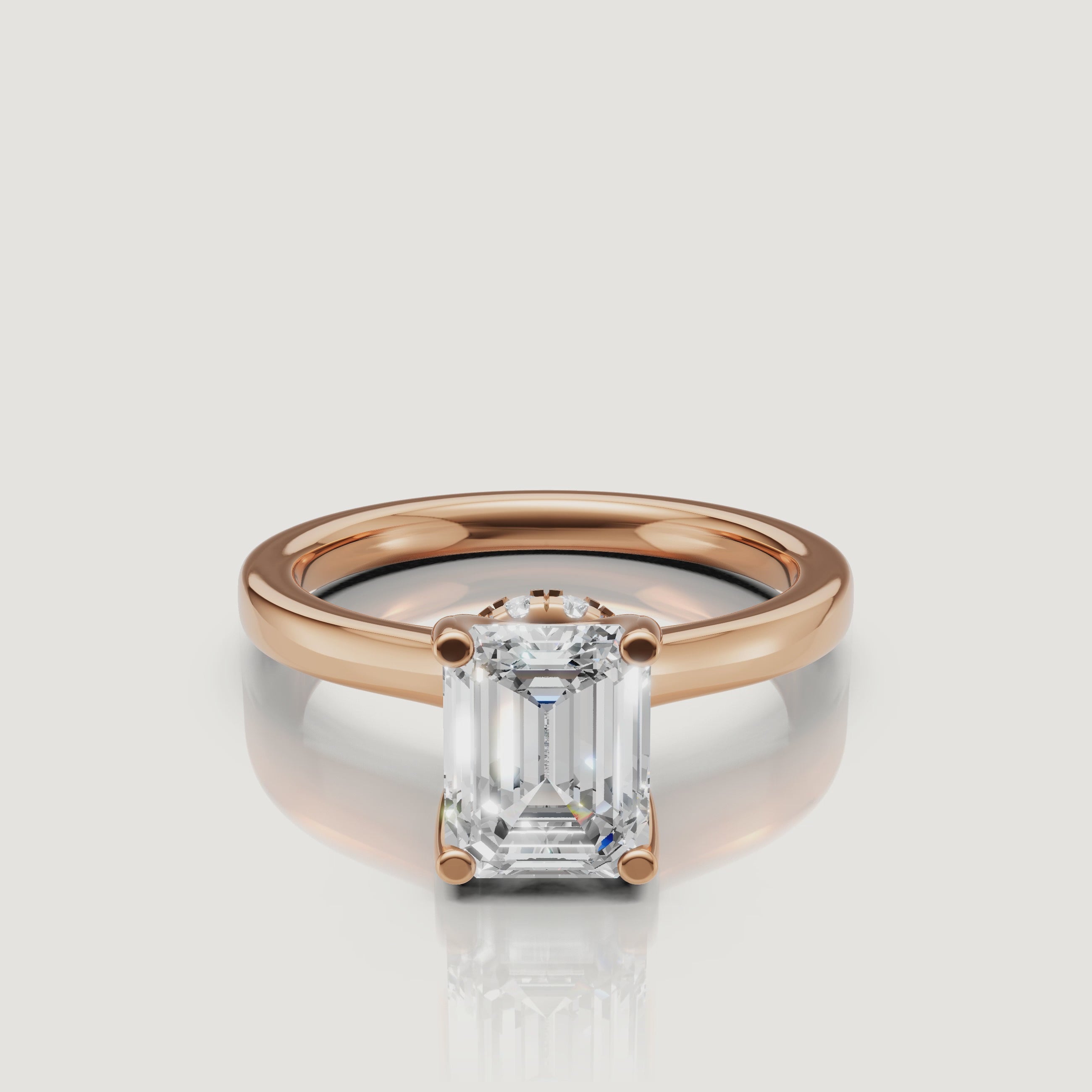 video of emerald cut lab grown diamond solitaire engagement ring in 14k rose gold with hidden halo