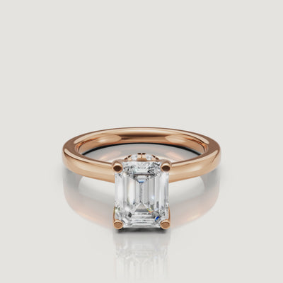 video of emerald cut lab grown diamond solitaire engagement ring in 14k rose gold with hidden halo