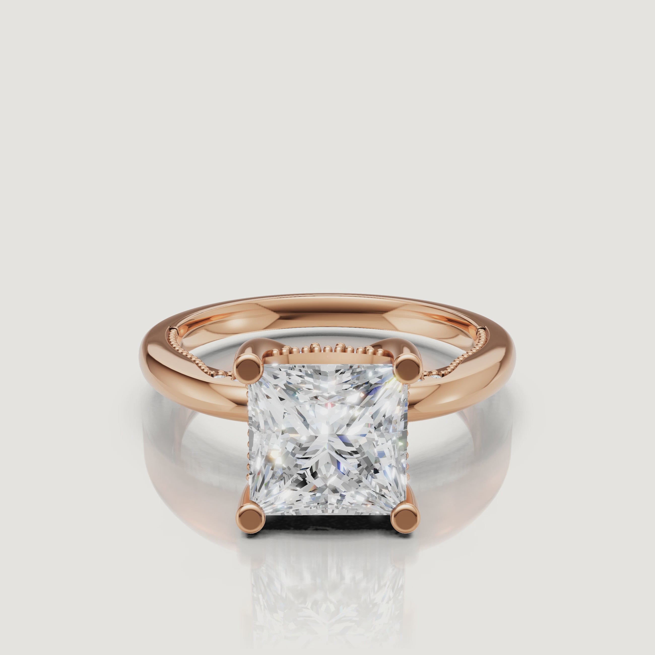 Close-up video of a rose gold princess cut diamond ring by Raul Diamonds, capturing the romantic blush metal and high-intensity sparkle