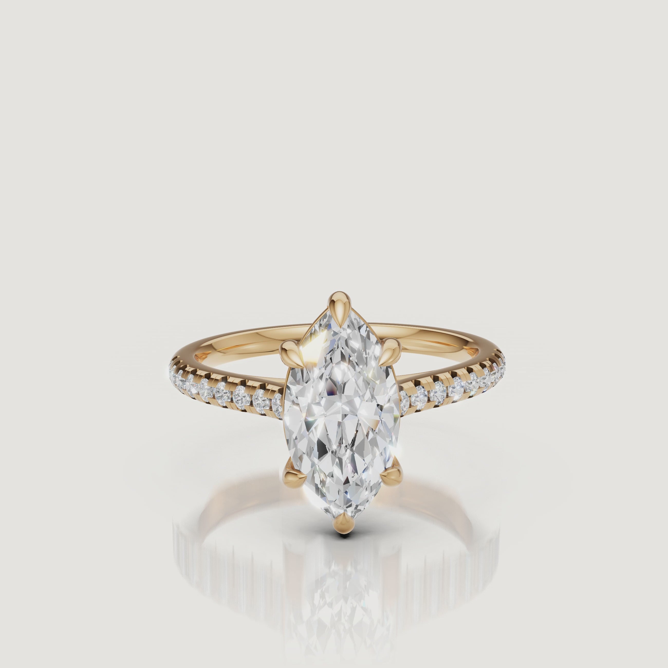Rotating video of Raul Diamonds marquise cut yellow gold engagement ring with pavé diamond band
