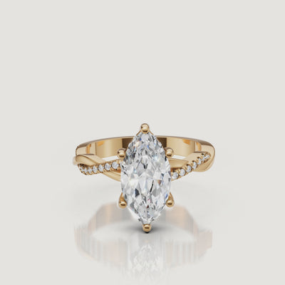 video of marquise cut lab grown diamond bypass engagement ring in 14k gold with pavé diamond crossover shank and modern elegance