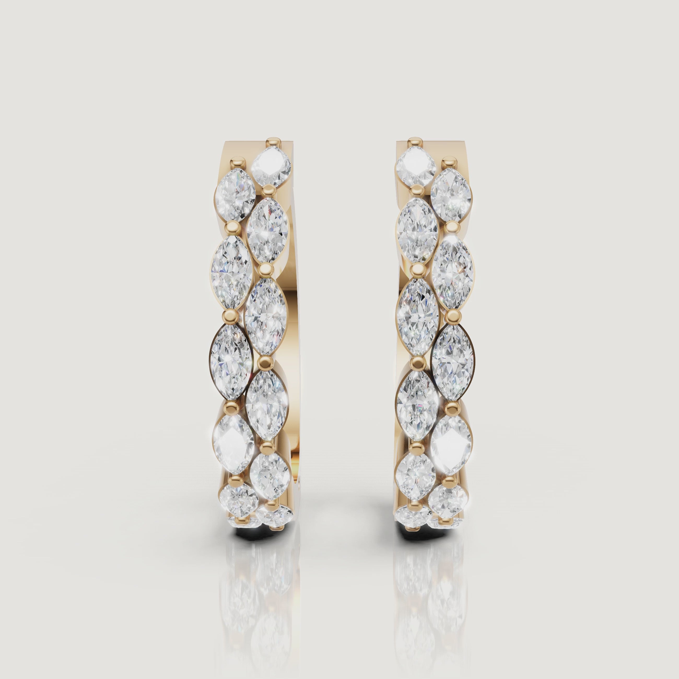 Yellow gold marquise diamond hoop earrings video showcasing brilliant sparkle by Raul Diamonds