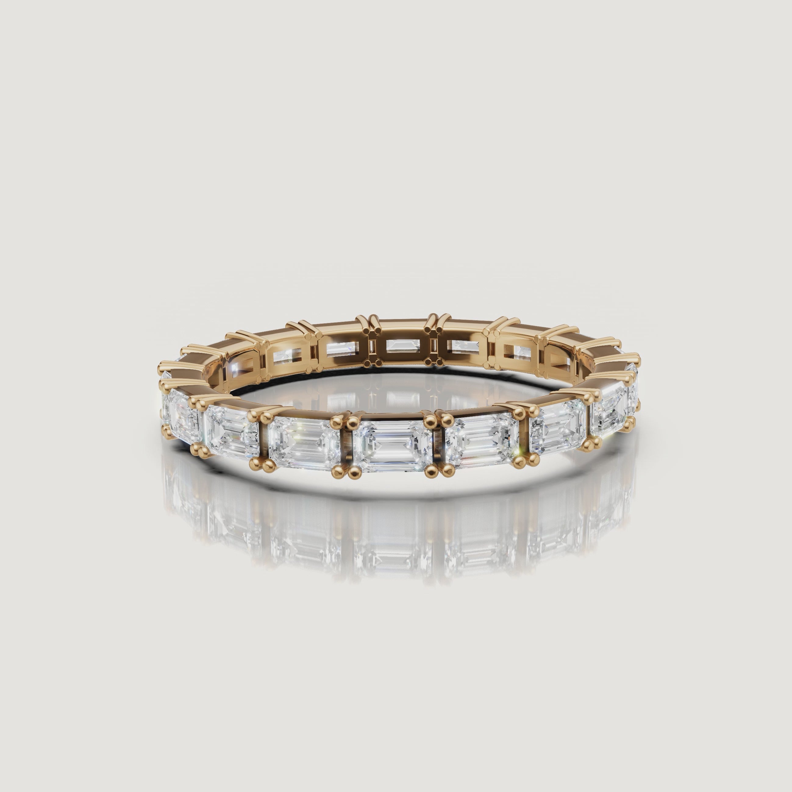 360 view of Raul Diamonds yellow gold emerald cut diamond eternity wedding band