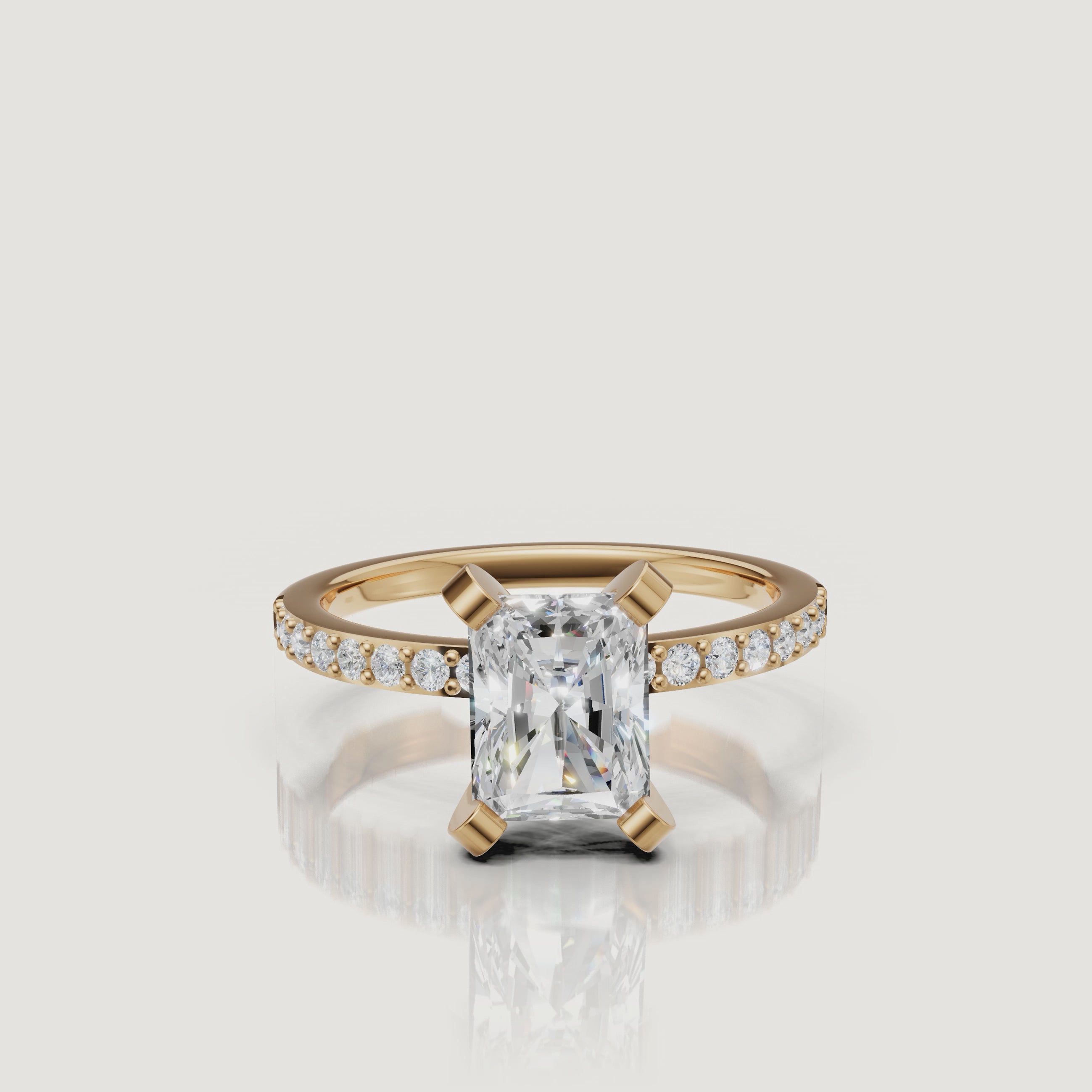Radiant cut lab grown diamond pavé engagement ring in 14K yellow gold by Raul Diamonds video showcase